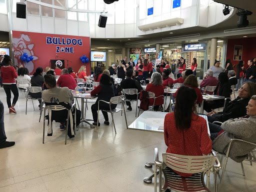 Staff members gather to celebrate Red Friday at the University student Union on Friday April 5, 2019. (Vanessa Rios/ The Collegian)
