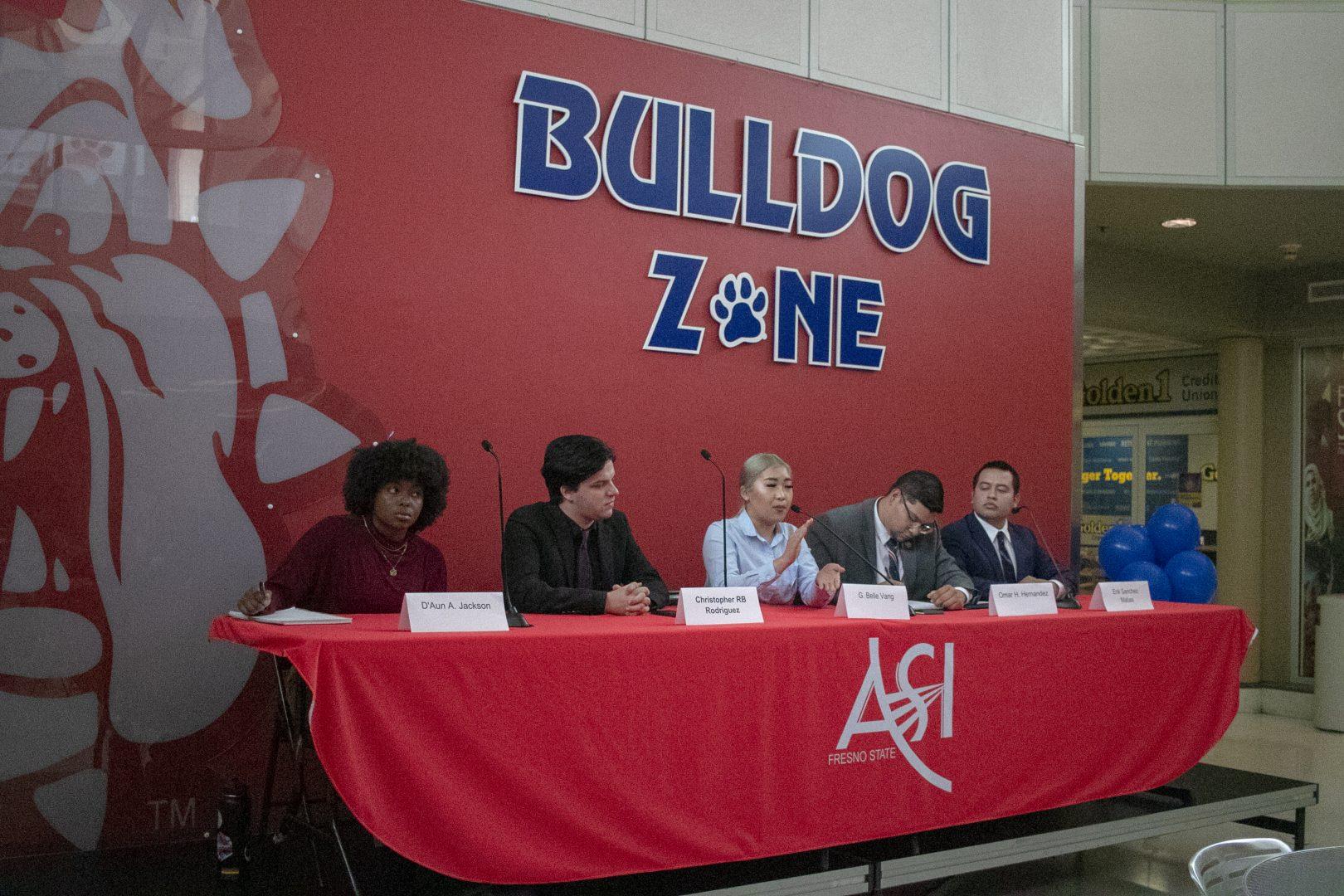 Candidates for the ASI presidency sit on a panel during the presidential debate in the University Student Union on April 5.