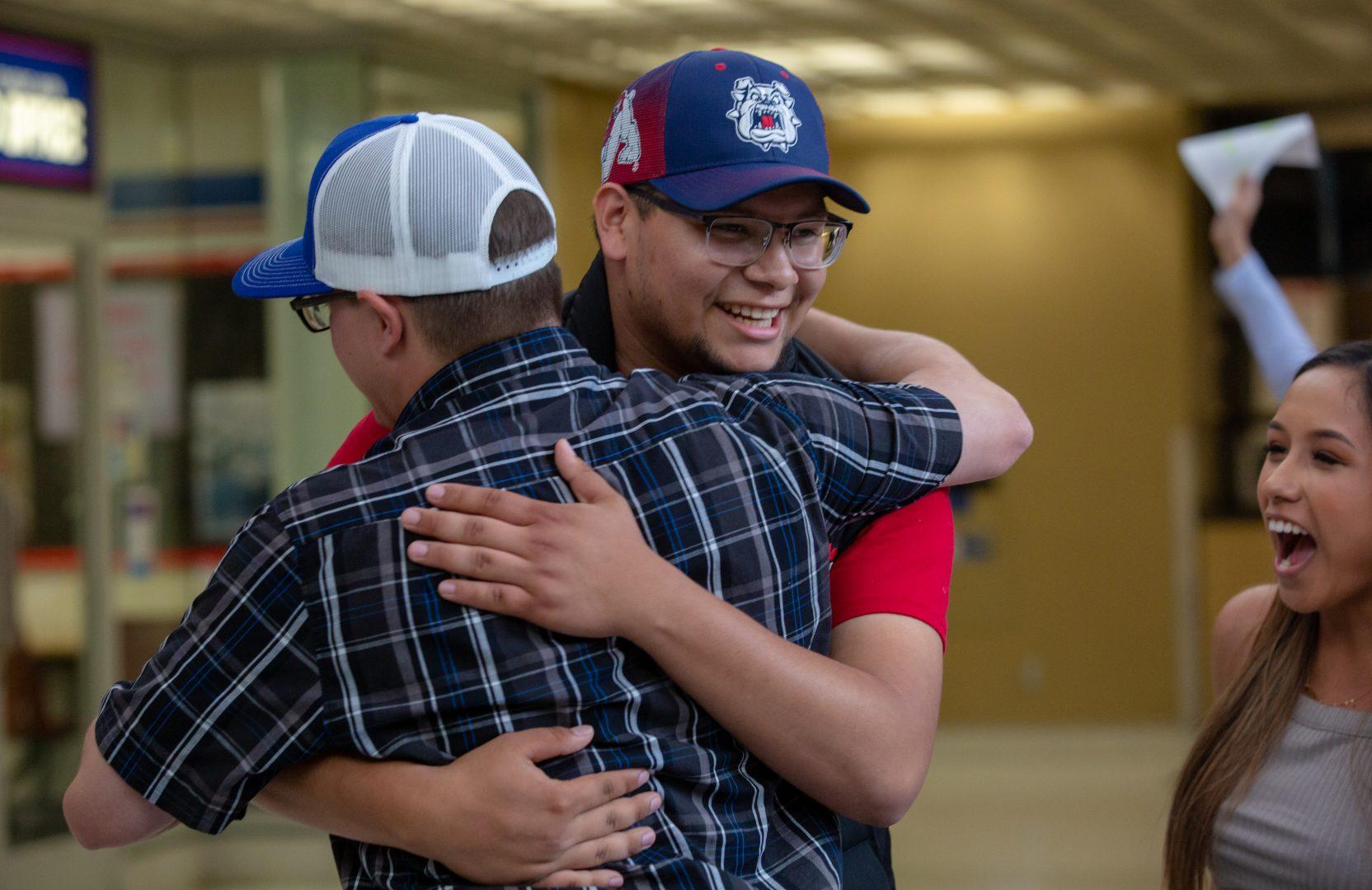 President-elect Omar H. Hernandez celebrates with a fellow student as he is announced the winner of the ASI presidential election. (Jose Romo Jr.)