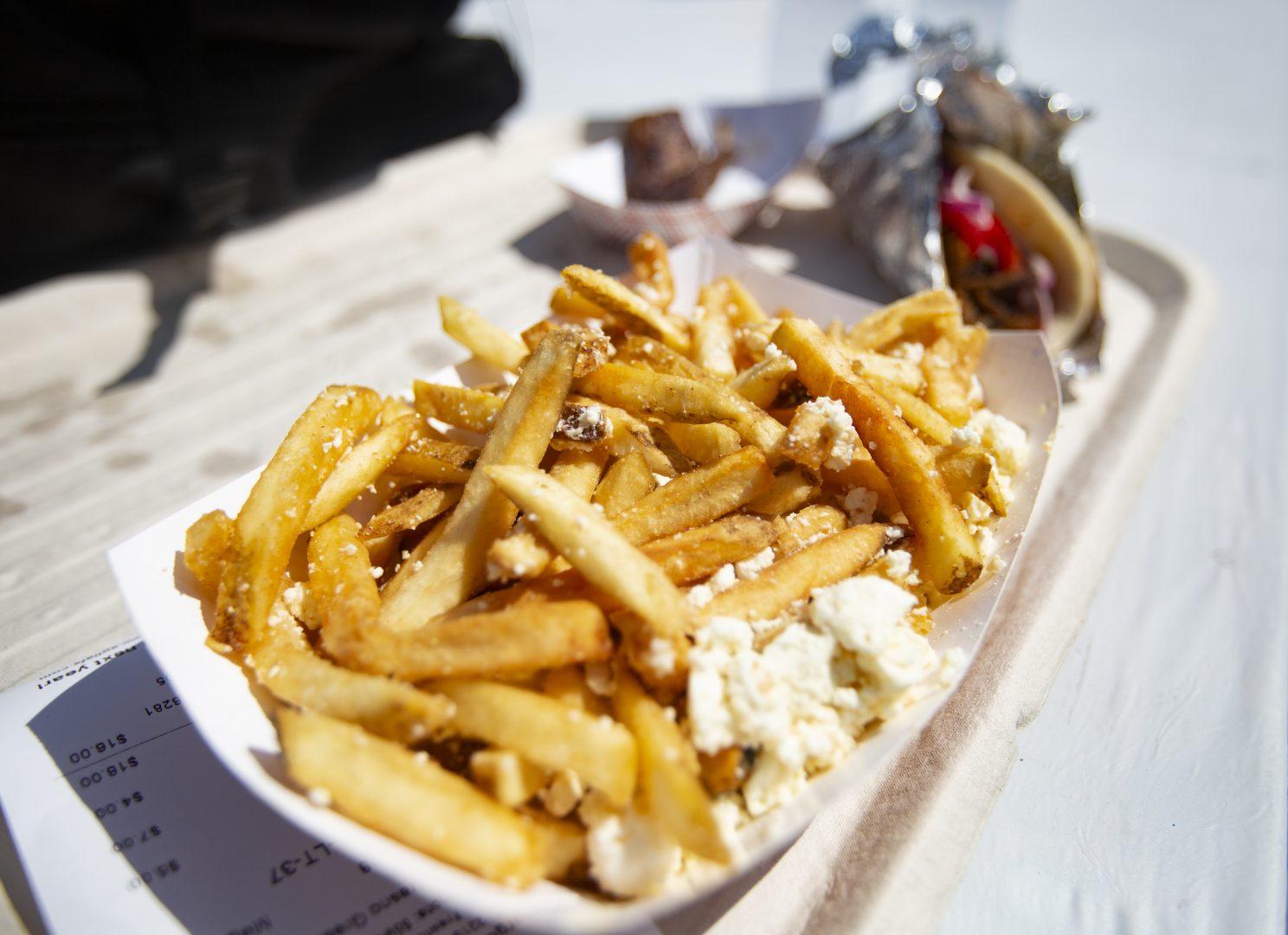 Feta fries was one of the Greek food items guests could buy during the 59th annual Fresno Greek Fest on Saturday, Aug. 24, 2019.  (Larry Valenzuela/The Collegian)