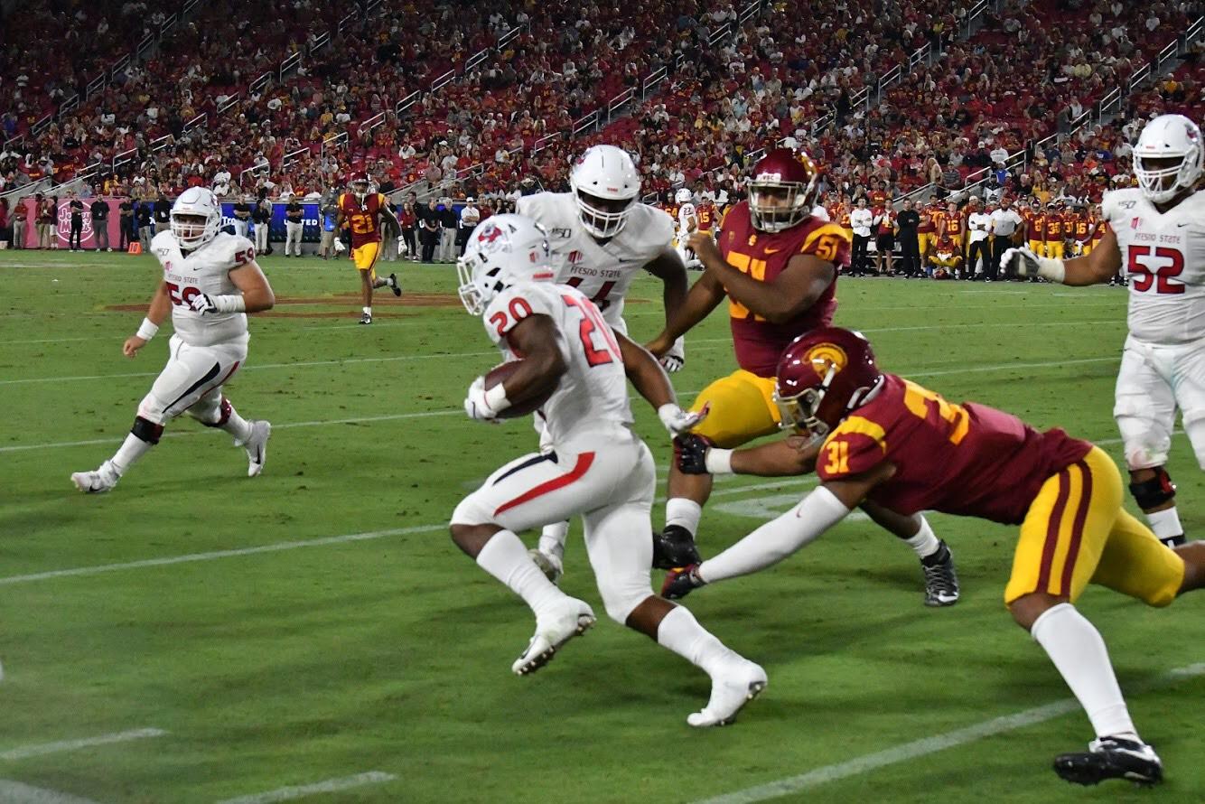Fresno+State+running+back+Ronnie+Rivers+gets+through+several+USC+defenders+during+an+away+game+at+the+Los+Angeles+Coliseum+on+Saturday%2C+Aug.+31%2C+2019.+%28Nugesse+Ghebrendrias%2FContributor%29