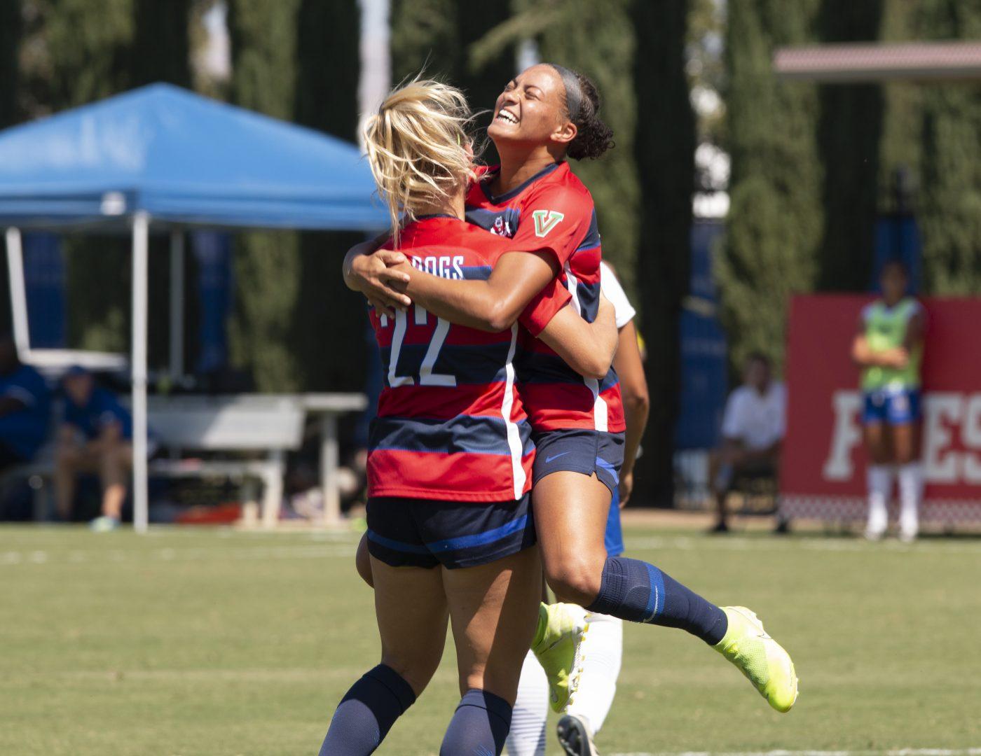 Fresno States defender Robyn McCarthy (left) and midfielder Sydni Lunt (right) embrace in celebration after Lunts goal during a match against UC Riverside at the Soccer and Lacrosse Stadium on Sunday, Sept. 22, 2019. (Jorge Rodriguez/The Collegian)