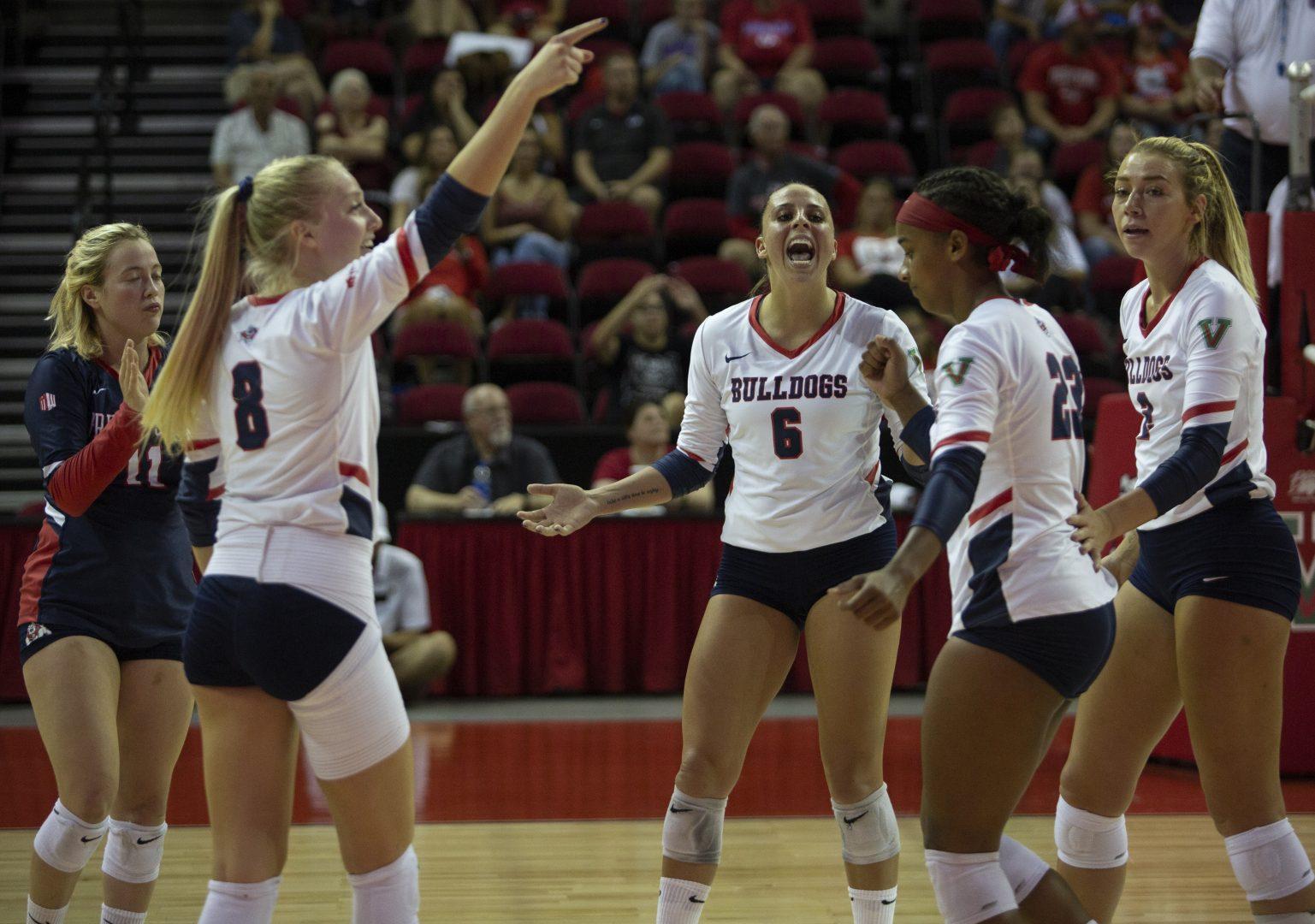 Volleyball team celebrates a point made by Amilya Thompson against the Nevada Wolf Pack at The Save Mart Center on Thursday, Sept. 26, 2019. (Larry Valenzuela/ The Collegian)