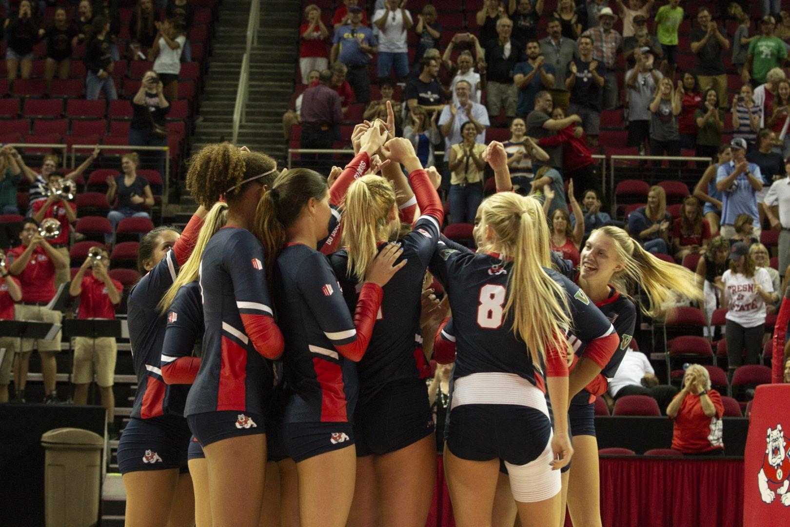 The Fresno State womens volleyball team celebrates after a victory during a home match at the Save Mart Center on Friday, Sept. 6, 2019. (Jorge Rodriguez/The Collegian)
