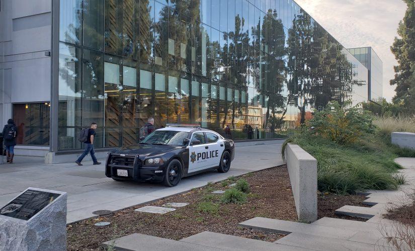 A university police patrol car parked outside the Henry Madden Library. The university police department is one of one of the four police agencies with jurisdiction on or around Fresno State campus. (Seth Casey/ The Collegian)