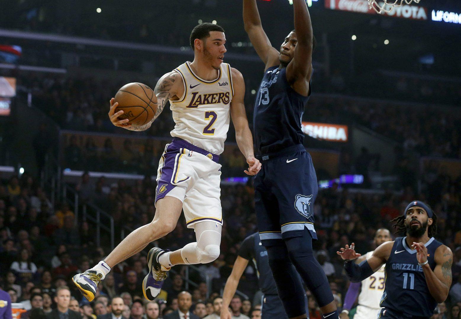 Los Angeles Lakers guard Lonzo Ball (2) attempts a pass while guarded by Memphis Grizzlies forward Jaren Jackson Jr. (13) on December 23, 2018, at Staples Center in Los Angeles. (Gary Coronado/Los Angeles Times/TNS)
