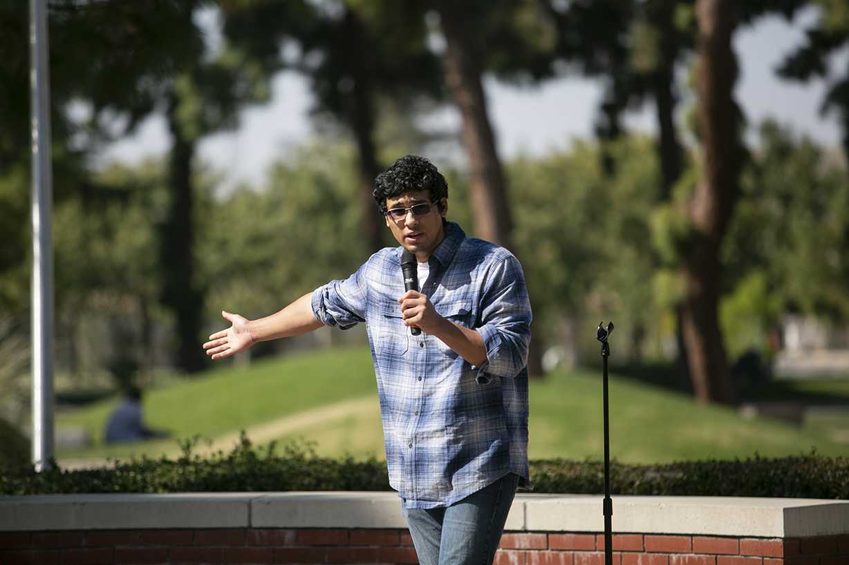 Bryce Herrera leads a dicussion to instate Indigenous Peoples’ Day in place of Columbus Day in the Free Speech area at Fresno State on Monday, Oct. 14, 2019. (Larry Valenzuela/The Collegian)