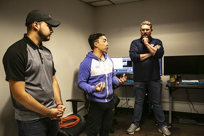 Tommy Lee (middle) introduces himself alongside Gerrado Gomez (left) and Lars Newlander to students attending the League of Legends info session held inside of the eSports arena on Monday, Oct. 28, 2019. (Larry Valenzuela/ The Collegian)