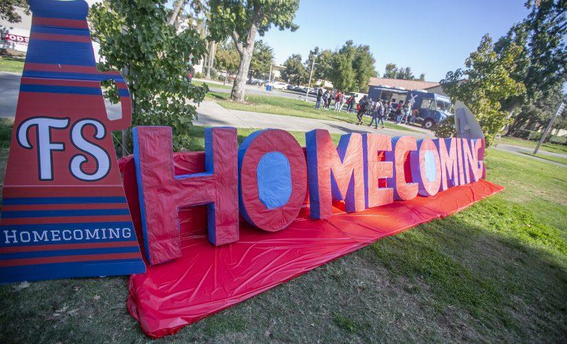 A Homecoming sign at the Kick Off rally in the lawn area in front of the Kennel Bookstore on Oct. 21. (Larry Valenzuela/The Collegian)