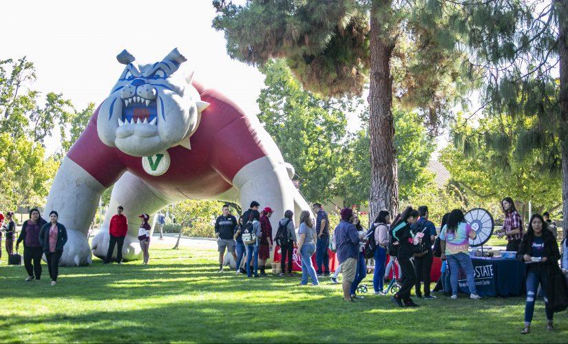 Fresno State students check out games and activities at booths during the National Student Day celebration in front of the Kennel Bookstore on Thursday, Oct. 17, 2019. (Larry Valenzuela/The Collegian)