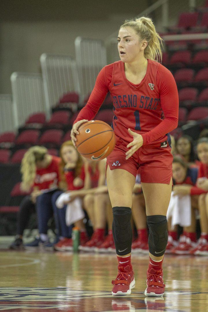 Fresno State guard Haley Cavinder gets ready to pass the ball during a home match at the Save Mart Center against the Northern Arizona Lumberjacks. Cavinder set a new program record on most points scored by a true freshmen in a game on Sunday, Nov. 24, 2019. (Marc Anthony Lopez/The Collegian)