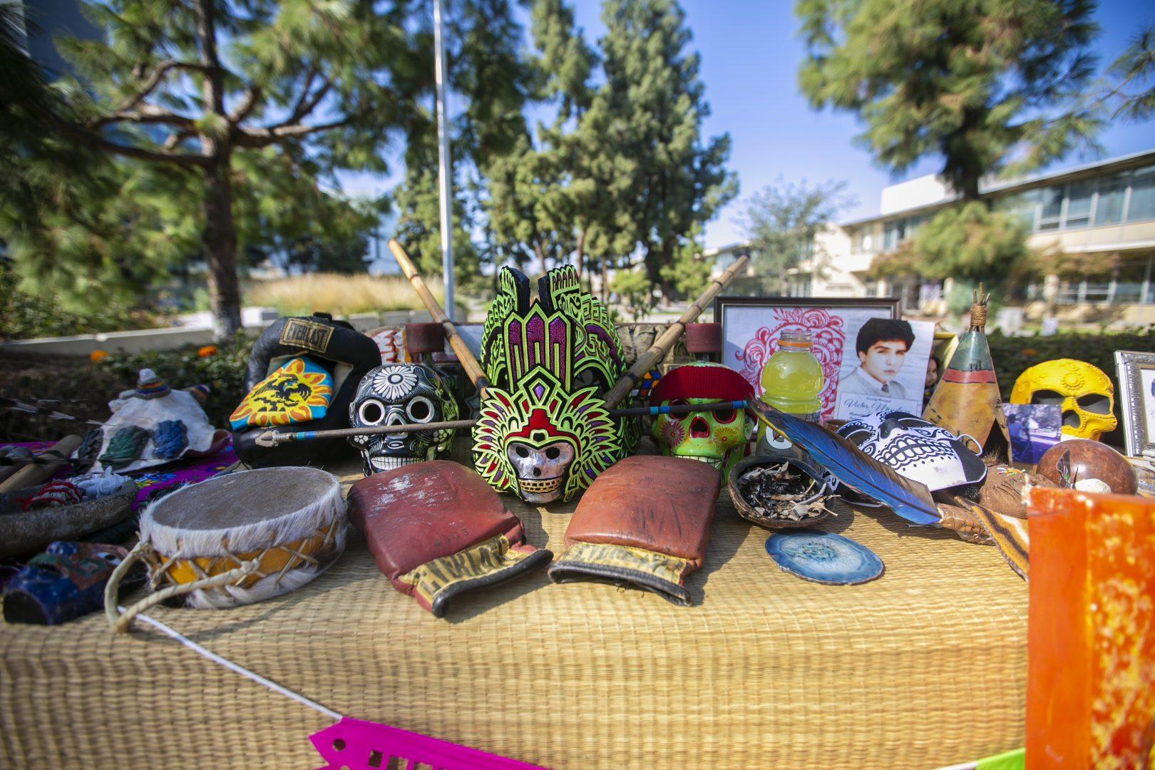An altar was made with decorations and personal mementos for the DÃ­a de los Muertos celebration to remember the dead near the free speech area on Saturday, Nov. 2, 2019. (Larry Valenzuela/The Collegian)