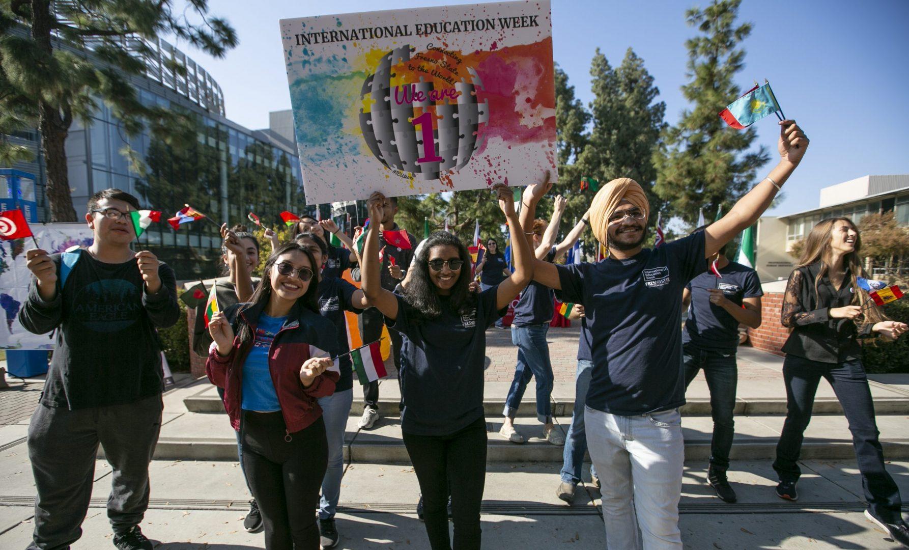 Students gather together to kick off International Education week as part of a flash mob to celebrate cultural diveristy on campus near the free speech area on Monday, Nov. 18, 2019. (Larry Valenzuela/The Collegian)