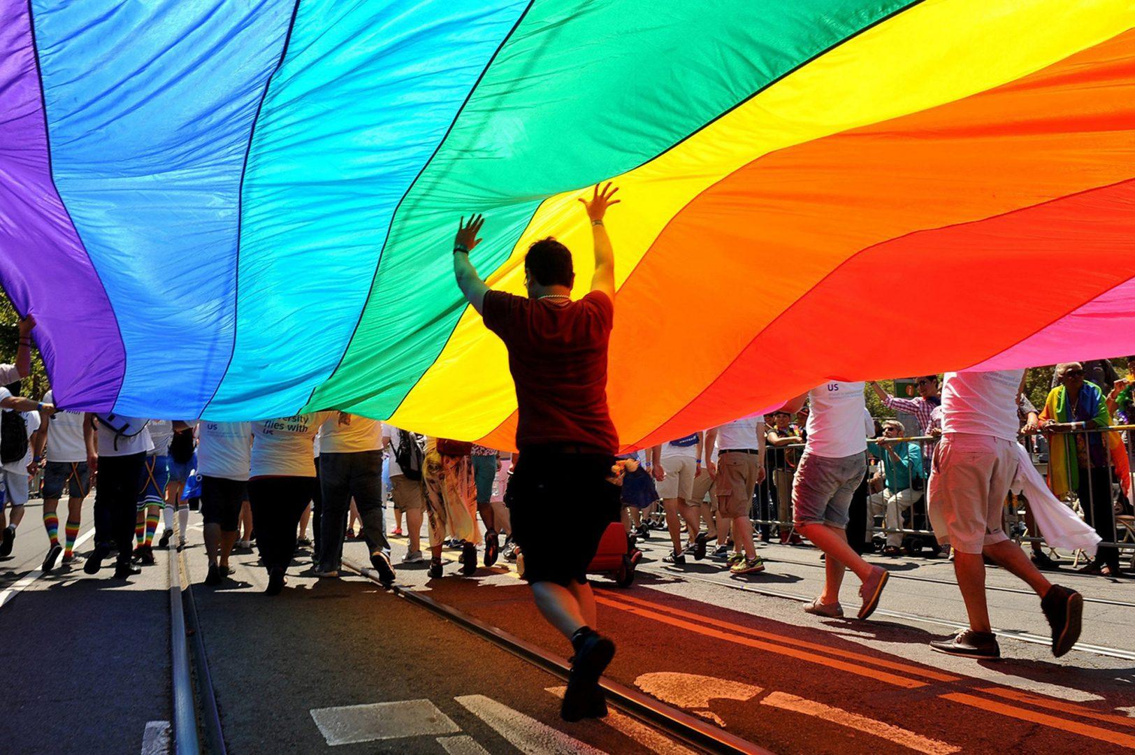 Parade participants march down Market Street carrying the rainbow flag during the annual Gay Pride parade in San Francisco on June 30, 2013. (Wally Skalij/Los Angeles Times/TNS)