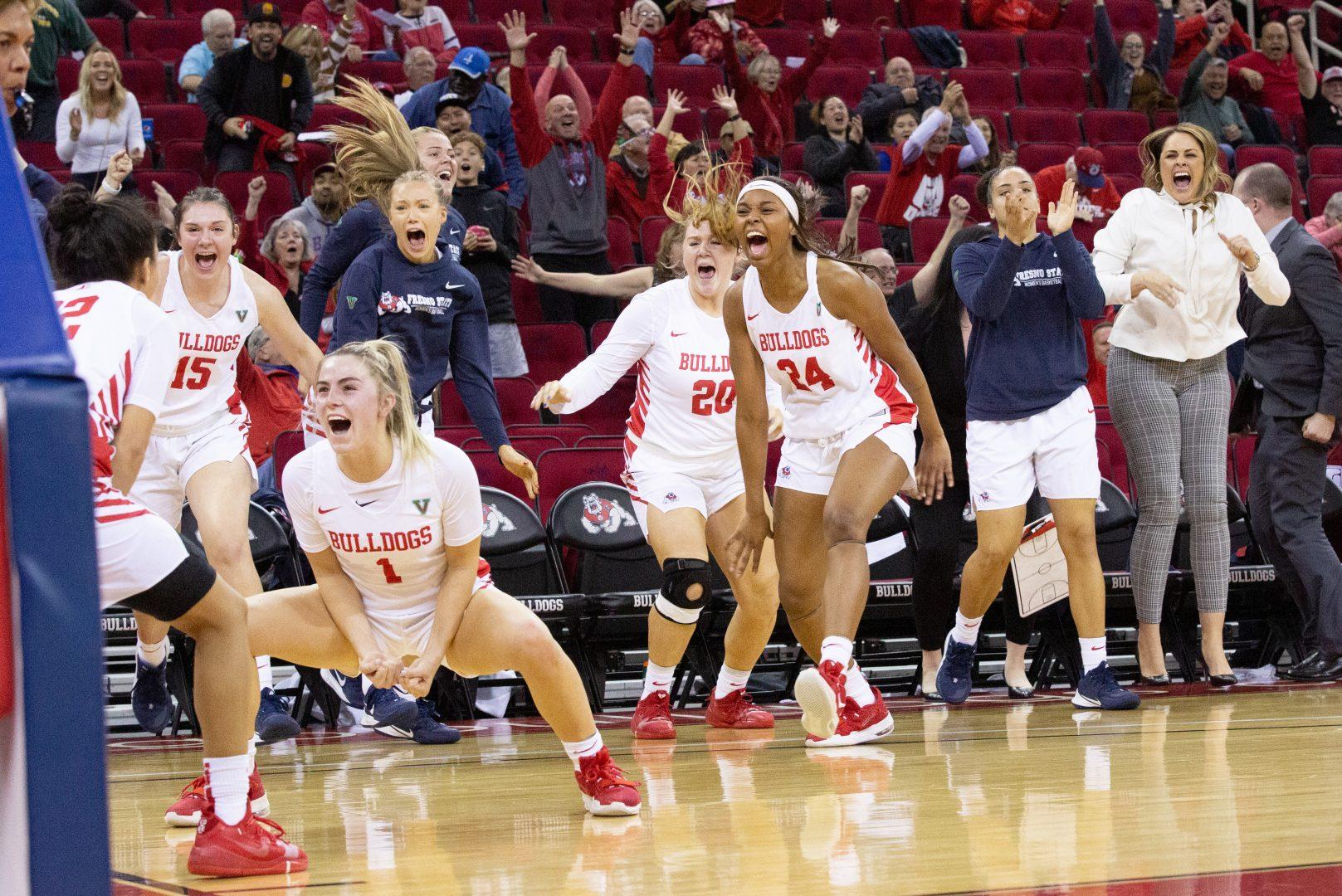 Aly Gamez (22) celebrates with her teammates after shooting the game winning layup at the buzzer against Colorado State Rams at the Save Mart Center on Wednesday, Jan. 22, 2020. (Armando Carreno/The Collegian)