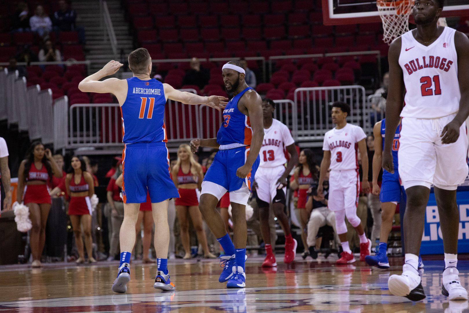 Boise’s RJ Williams (23) and teammate Riley Abercrombie (11) celebrate as Boise State adds to their double digit lead on Saturday Jan. 25 at the Save Mart Center. (Armando Carreno/The Collegian)
