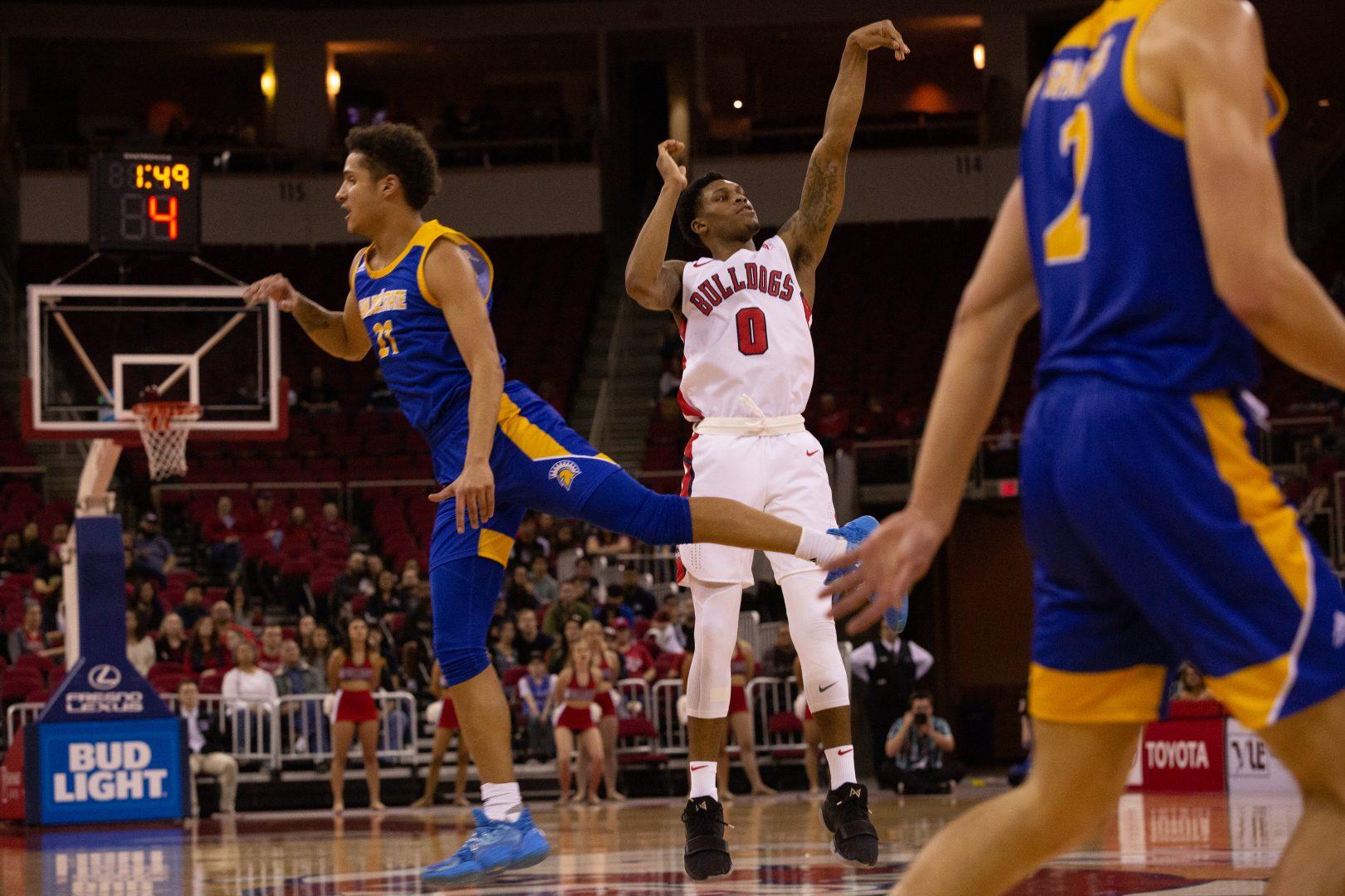 New Williams shoots a 3-pointer with a San Jose State defender crossing his face in the second half of Saturday January 4, 2020 at the Save Mart Center (Armando Carreno/The Collegian)