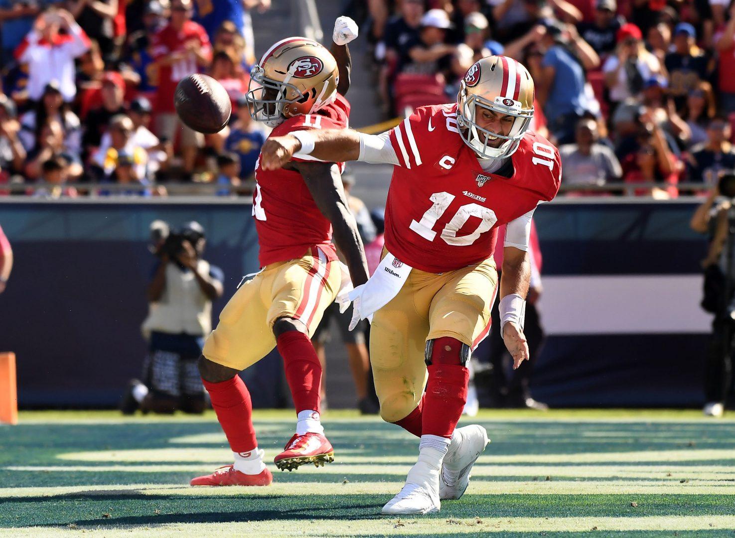 San Francisco 49ers quarterback Jimmy Garoppolo (10) spikes the ball after scoring a touchdown against the Rams in the 3rd quarter at the Coliseum on Oct. 13, 2019. (Wally Skalij/Los Angeles Times/TNS)