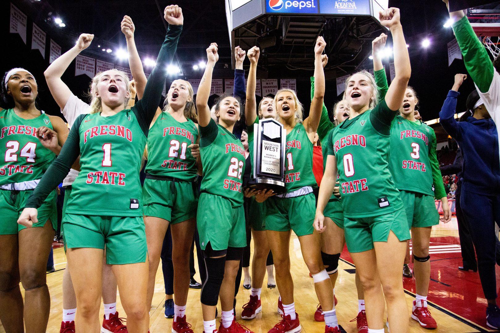 Fresno State women’s basketball team celebrate their Mountain West title, clinching win in front of the student section at the Save Mart Center on Wednesday Feb. 12, 2020. (Armando Carreno/The Collegian)