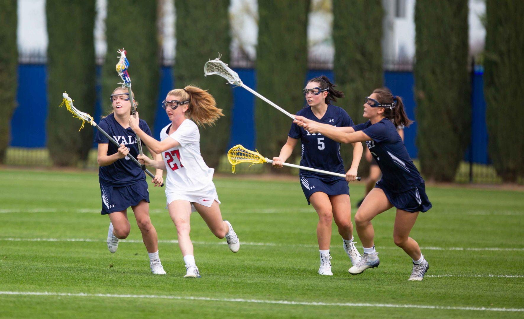Hennessey Evans passes the ball in a lacrosse match against Yale on Thursday, March 12, 2020. Fresno State athletics announce the cancellation of all spring sporting events indefinitely earlier Thursday. (Larry Valenzuela/The Collegian)