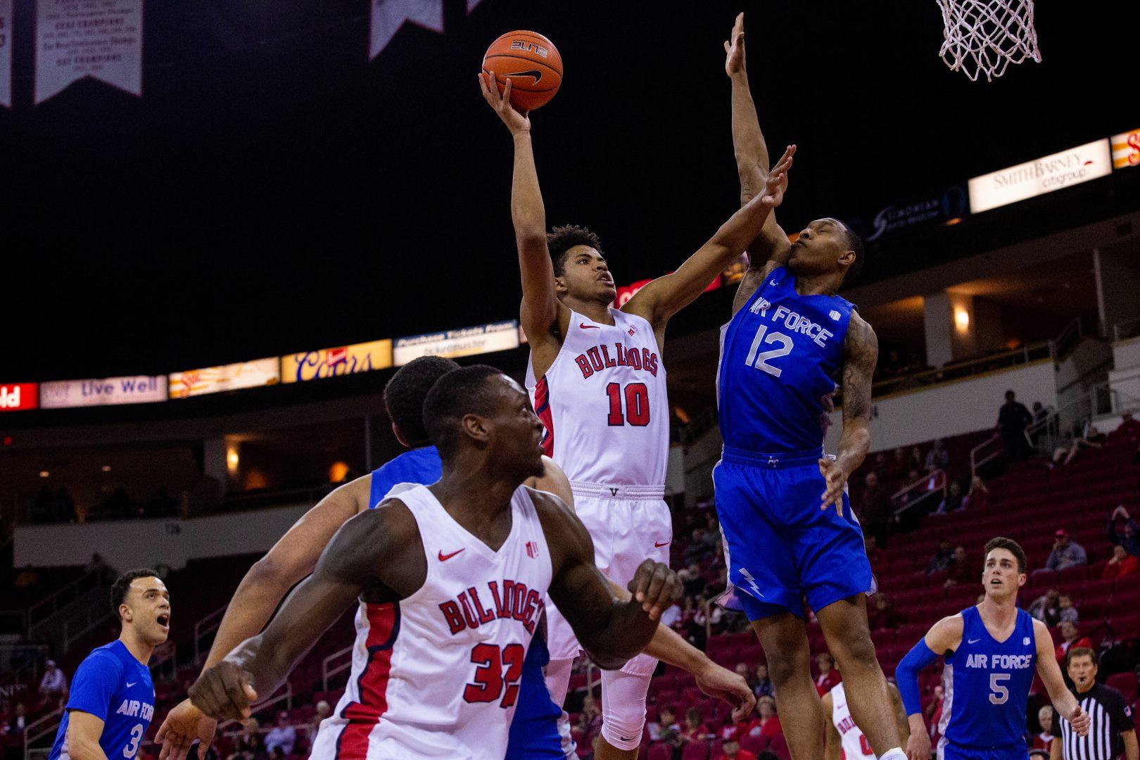 Orlando Robinson (10) shoots a field goal over Air Force defender Lavelle Scottie (12) in the first half at the Save Mart Center on Tuesday, Jan. 28. 2020. (Armando Carreno/The Collegian)