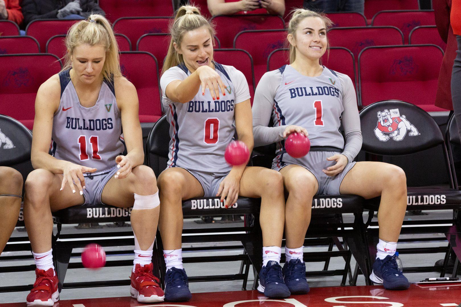 Maddi Utti (11), Hanna Cavinder (0) and Haley Cavinder (1) on the bench before player introductions against Wyoming at the Save Mart Center on Saturday, Jan. 18, 2020 (Armando Carreno/The Collegian)