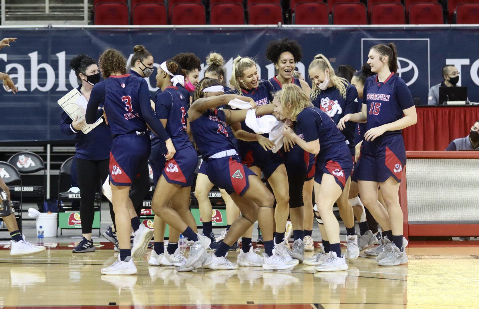 The Bulldogs celebrate after a last second shot at the end of the third quarter by senior guard Bree Delaney (20), in the game against Boise State on Thursday, Jan. 21, 2021, at the Save Mart Center. (Kameron Thorn/ The Collegian)