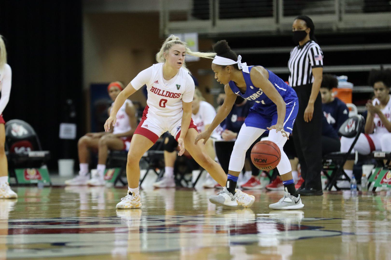 Fresno State guard Hanna Cavinder (0) guards the ball during the game against Air Force on Feb. 10, 2021, at the Save Mart Center. (Kameron Thorn / The Collegian)