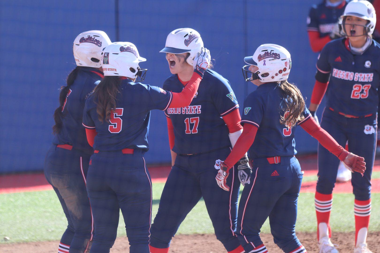 The+Fresno+State+Bulldogs+celebrate+after+catcher+Kelcey+Carrasco+%2817%29+hits+a+home+run+with+bases+loaded+during+their+game+against+San+Jose+State+at+Margie+Wright+Diamond+on+Saturday%2C+March+20%2C+2021.+%28Kameron+Thorn%2FThe+Collegian%29