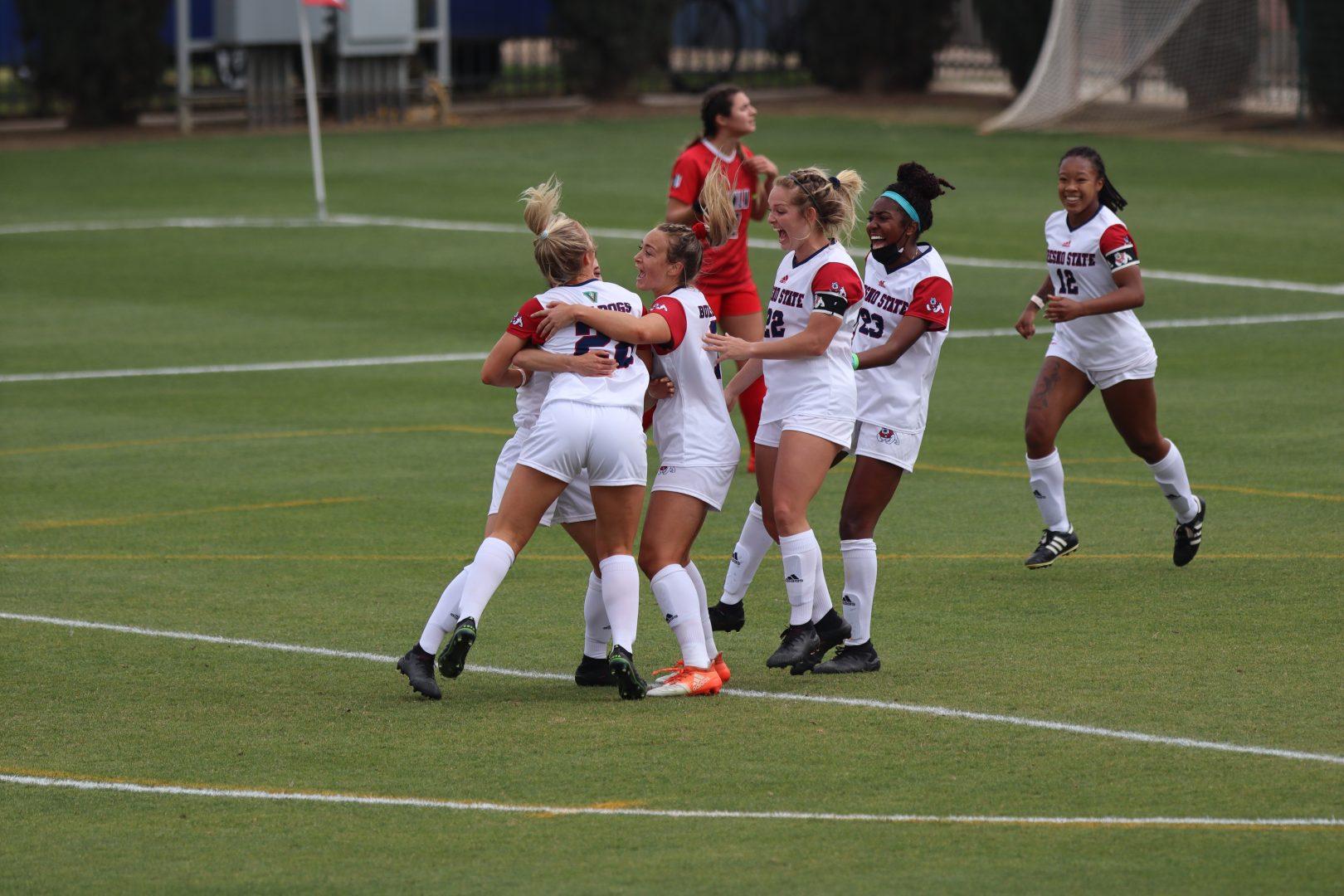 The Bulldogs celebrate after Fresno State defender Bailee Kern scores a goal against UNLV on March 12, 2021, at the Fresno State Soccer Stadium. (Kameron Thorn /The Collegian)