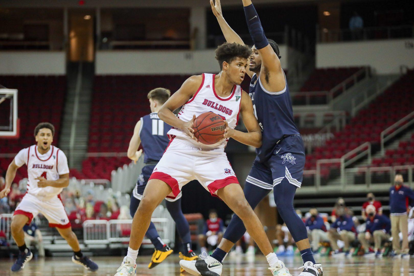 Fresno State forward Orlando Robinson is defended by Utah State forward Alphonso Anderson during the first half of the game at the Save Mart Center on Saturday, March 6, 2021. (Vendila Yang/The Collegian)