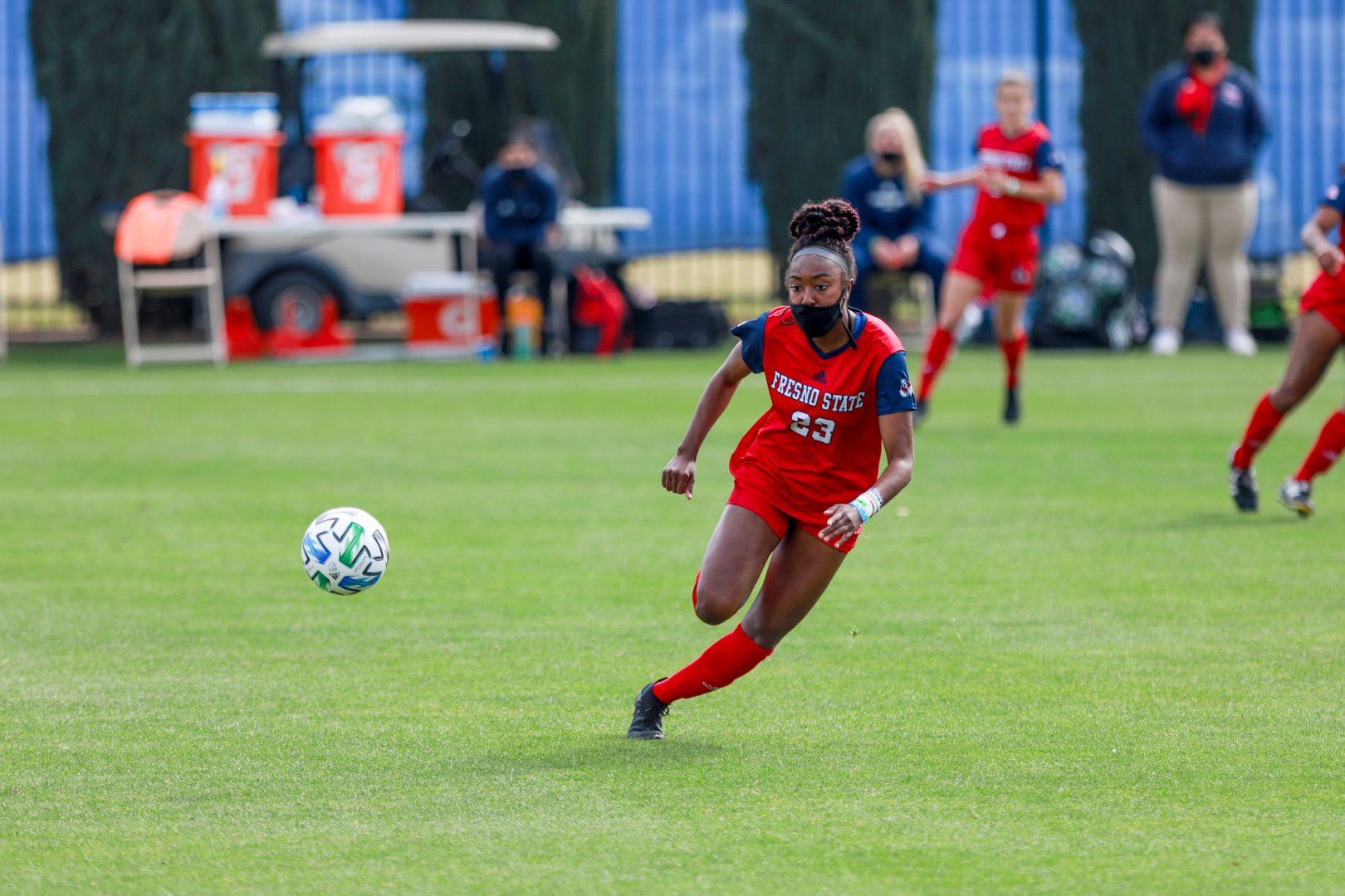 Fresno State forward Jordan Brown chases the ball during the first half of the game against SDSU at the Soccer and Lacrosse Stadium on Sunday, March 14, 2021. (Vendila Yang/The Collegian)
