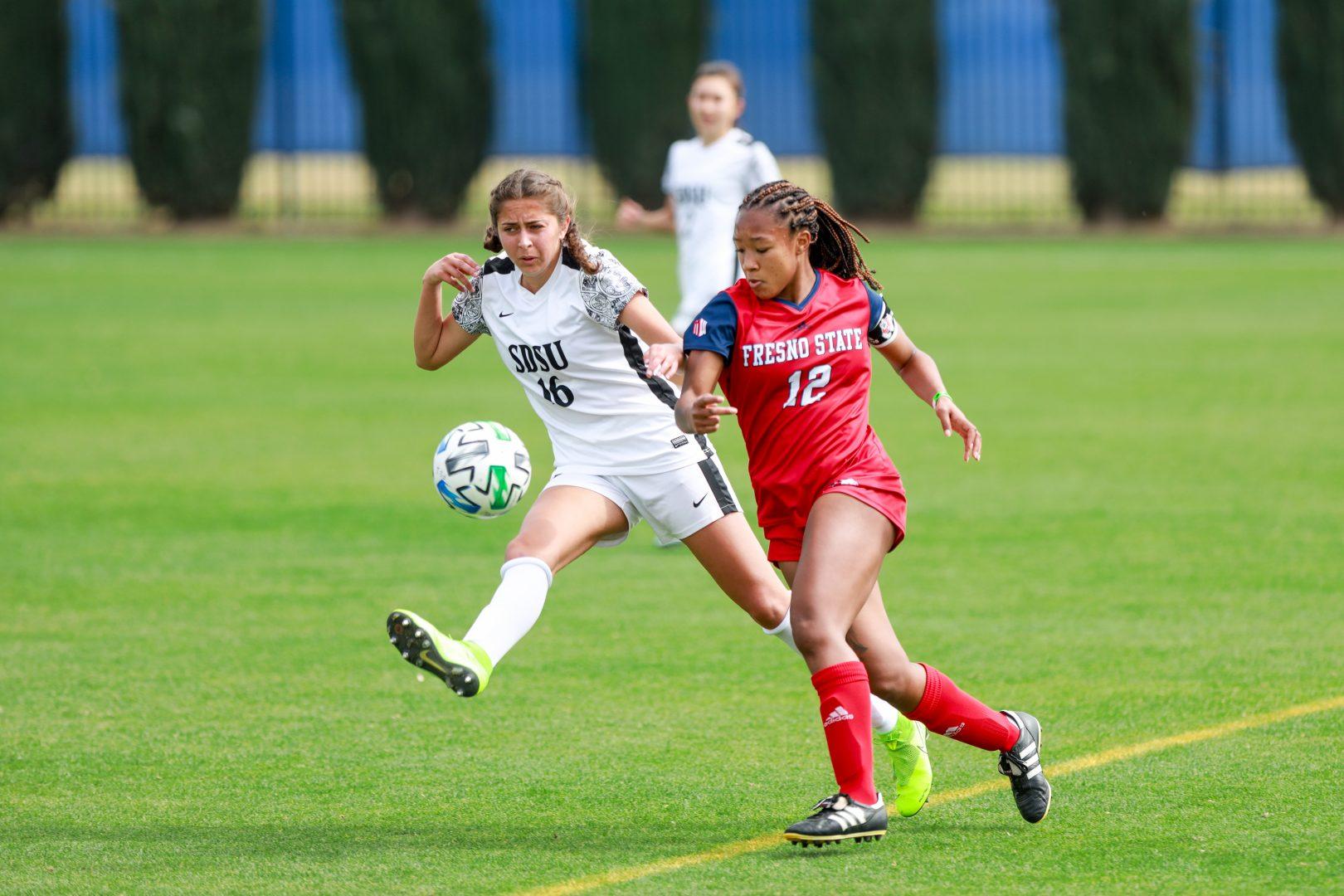 Fresno State forward Ele Avery is up against SDSU midfielder Kiera Utush during the first half at Soccer and Lacrosse Stadium on Sunday, March 14, 2021. (Vendila Yang/The Collegian)