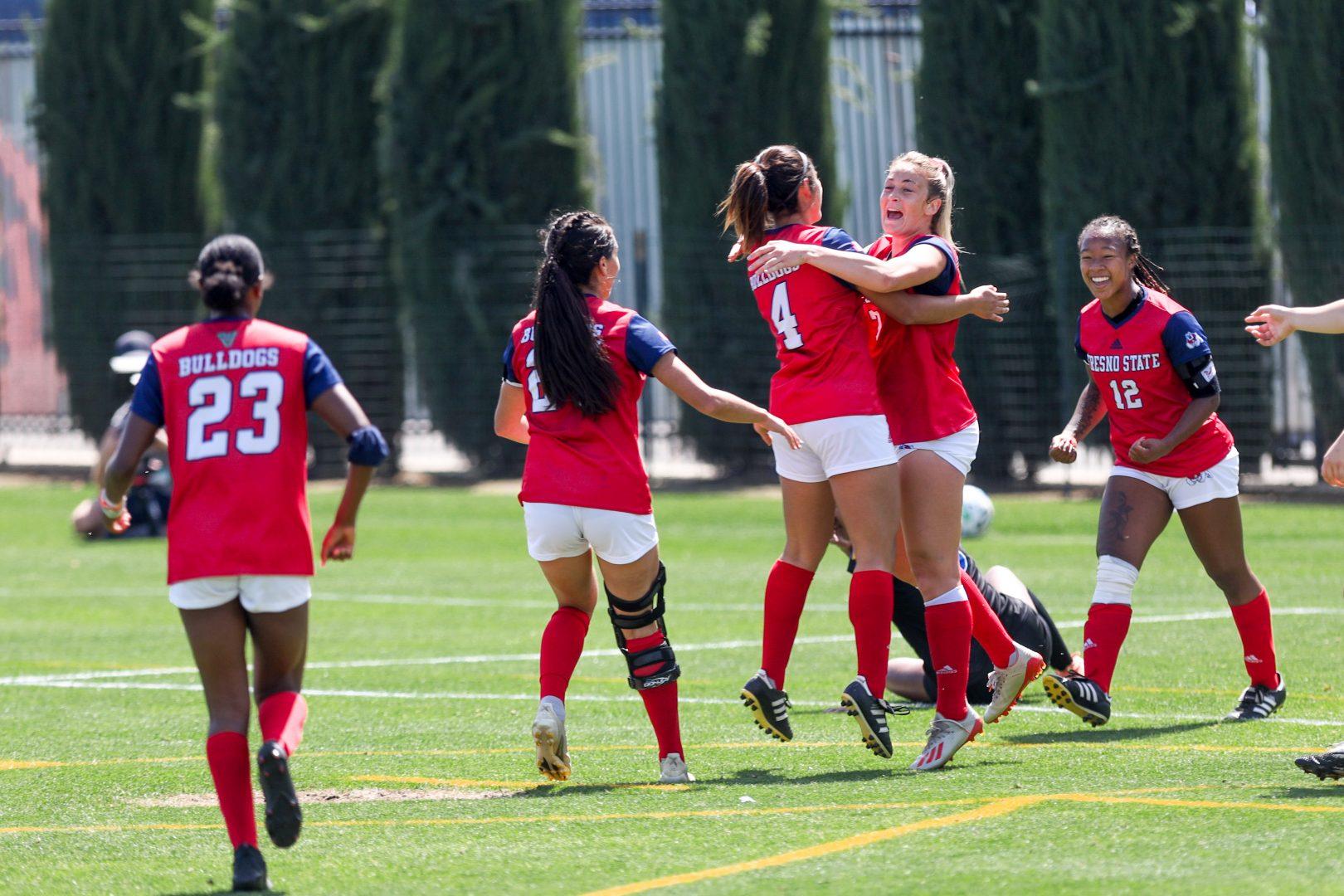 The Bulldogs celebrate their first goal made by midfielder/forward Katie Dohnel during the first half against San Jose State on Senior Day hosted at Fresno State on April 10, 2021 at the Soccer and Lacrosse Stadium. (Vendila Yang/The Collegian)
