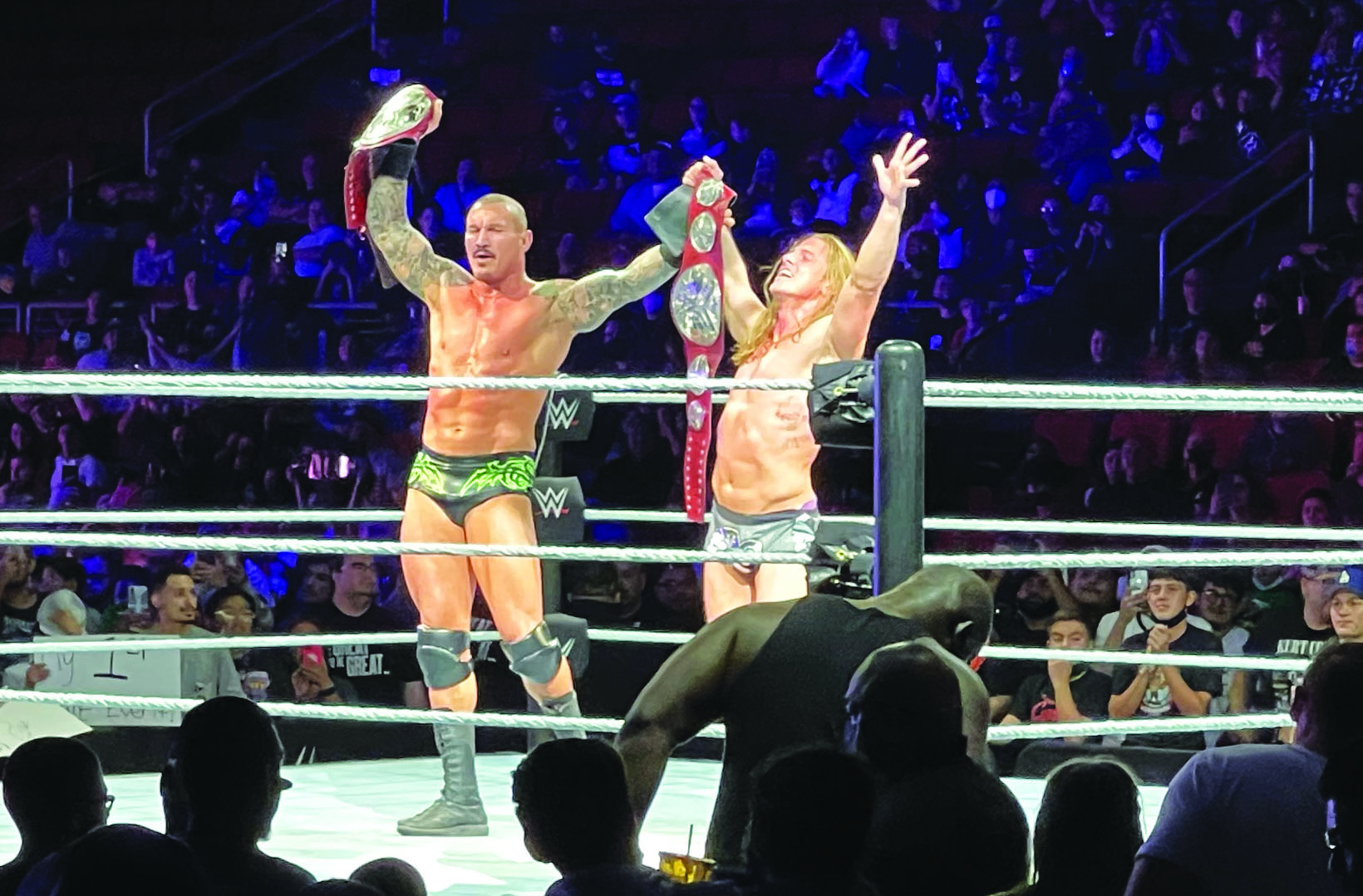 Wrestlers Randy Orton and Riddle celebrate their win.
(Marc Anthony Lopez/The Collegian)