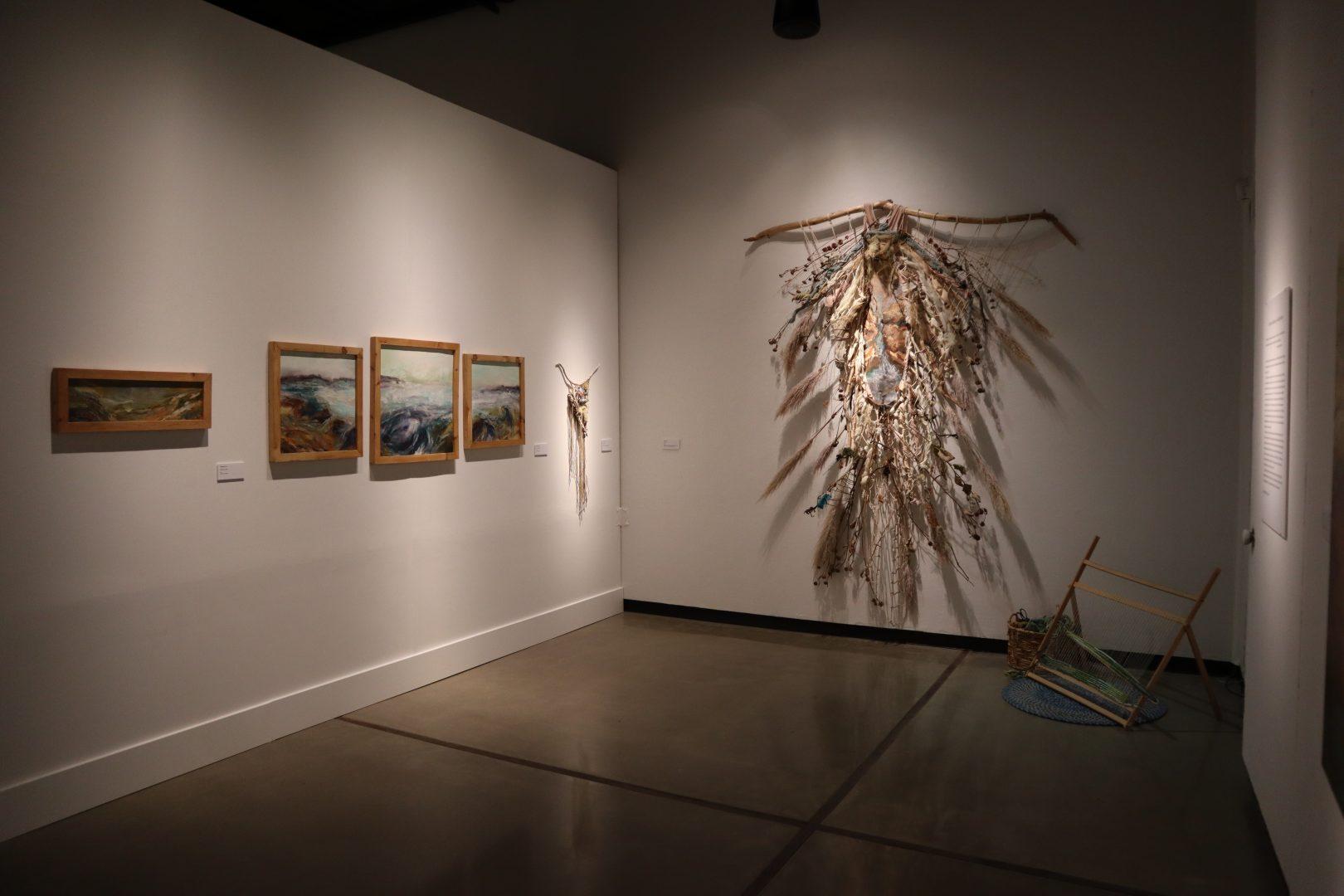Gabrielle Marie Luos exhibit features acrylic landscapes weaved together with driftwood, seaweed and other plant materials. (Kameron Thorn/The Collegian)