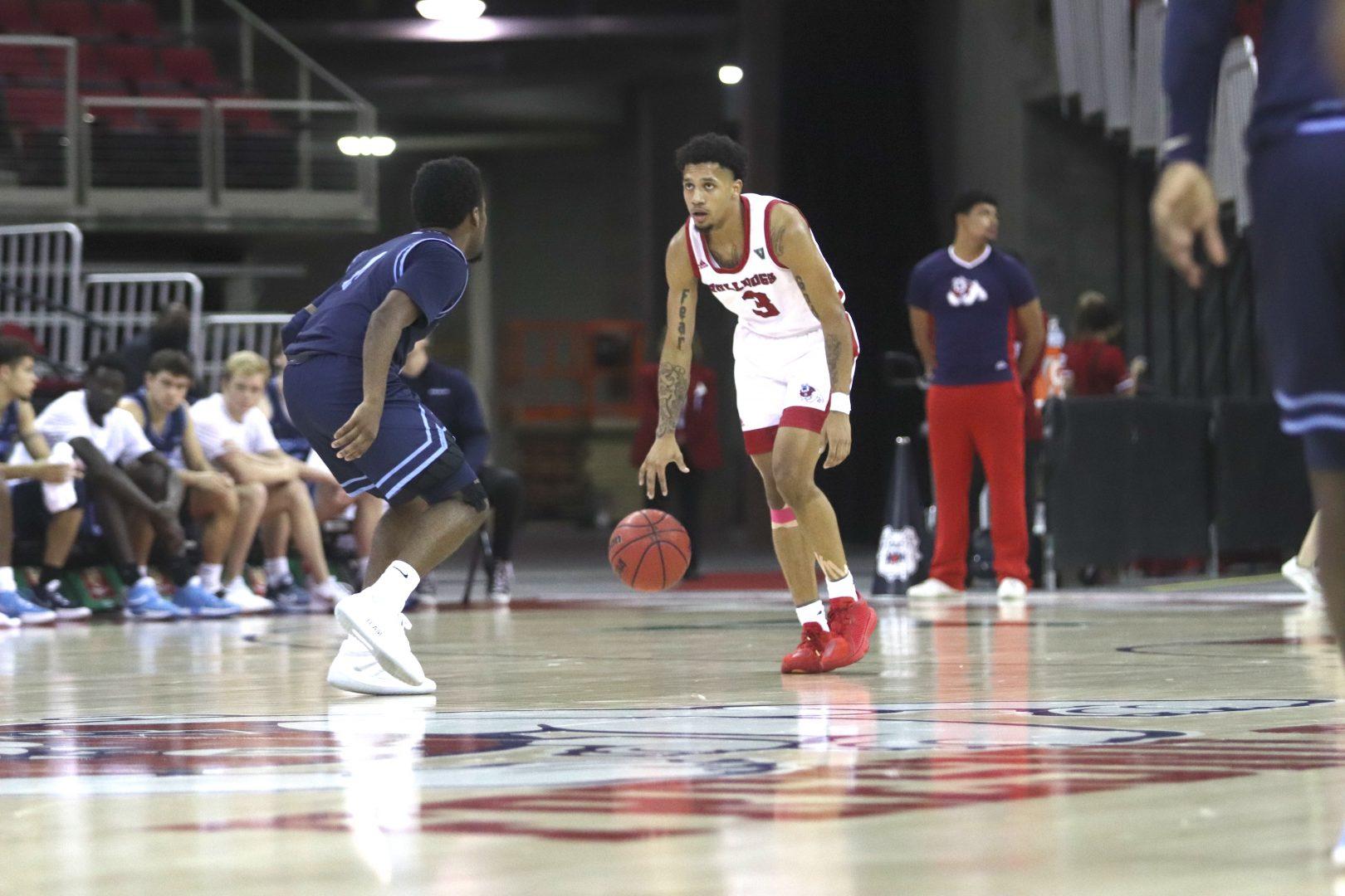 Fresno State guard Isaiah Hill starts an offensive play against San Diego on Wednesday, Dec. 1, 2021, at Save Mart Center. (Melina Kazanjian/The Collegian)