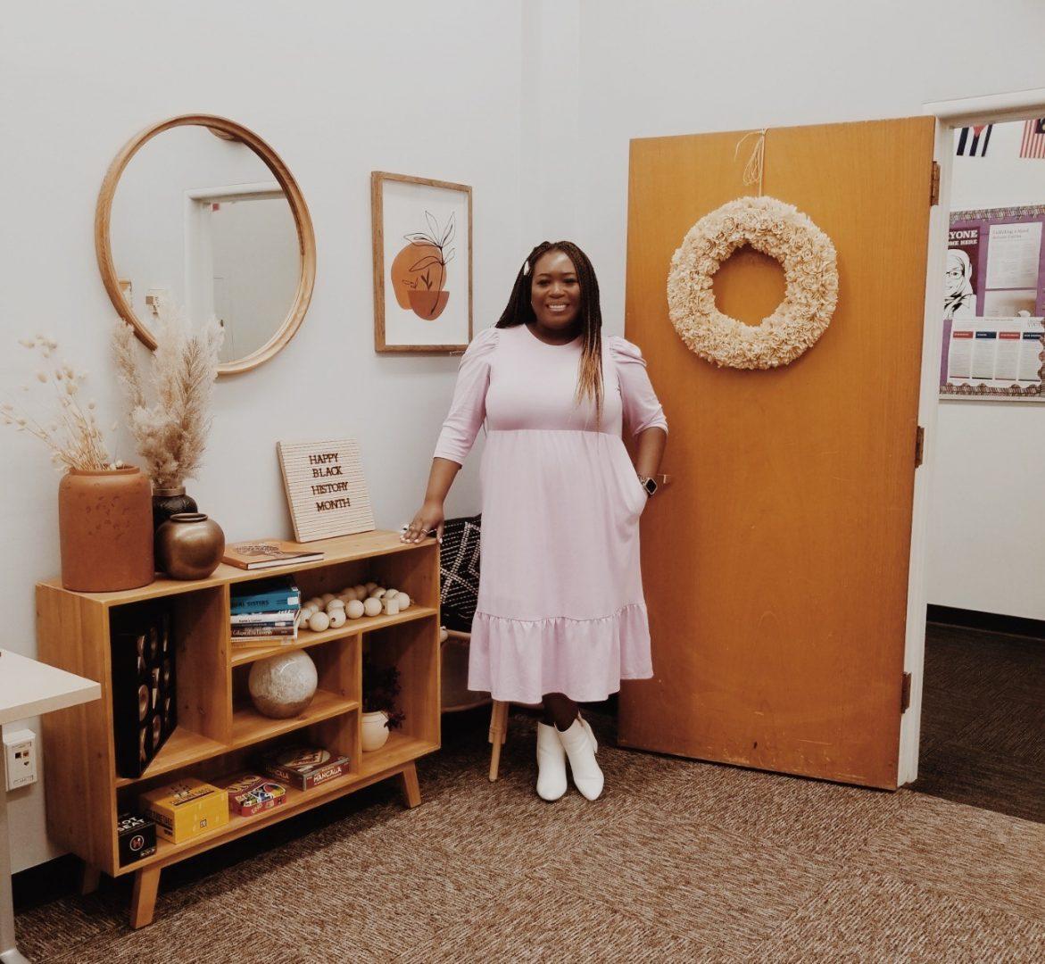 Former Fresno State African American Programs and Services (AFAM) program coordinator, Brianna White, poses inside the Harambee room, located in room 109 of the Thomas building. (Courtesy of Brianna White)