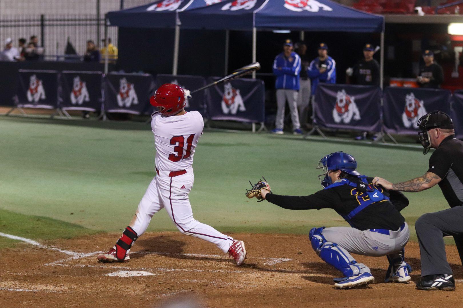 Fresno State outfielder Ivan Luna at bat in the first game of the opening series against UC Riverside Feb. 18, 2022. (Melina Kazanjian/ The Collegian) 
