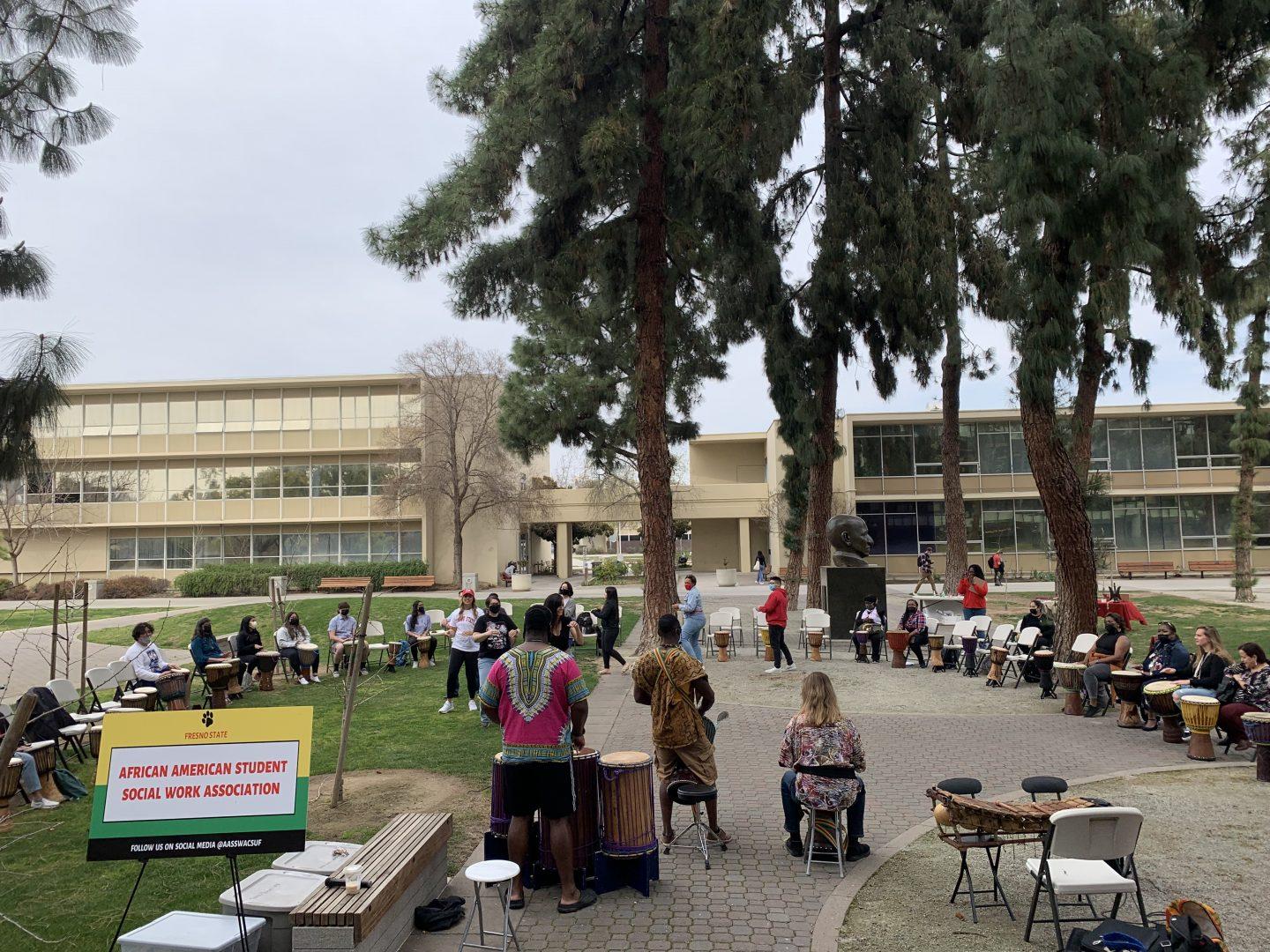 Fresno African Drumming initiate music and dance circles during its event at the Fresno State Peace Garden. (Jermaine Abraham/The Collegian)