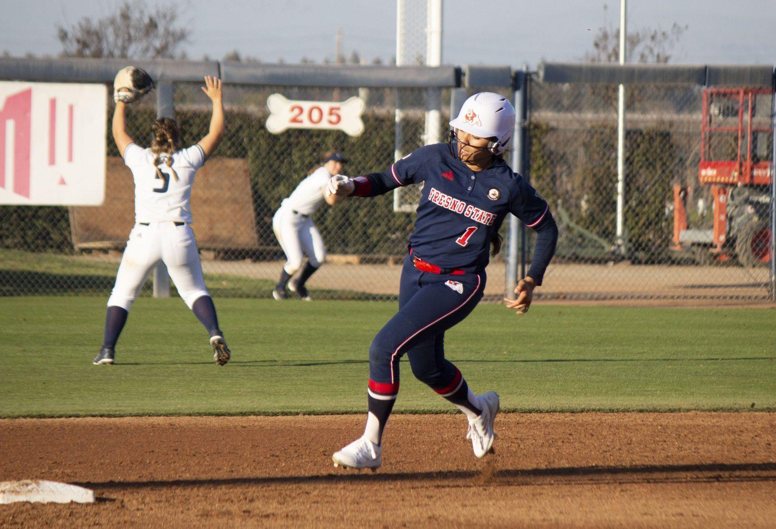 Fresno States, Keahilele Mattson, rounds second base in the double header game against UC Davis on Feb.19, 2022, at Margie Wright Diamond. (Julia Espinoza/ The Collegian)