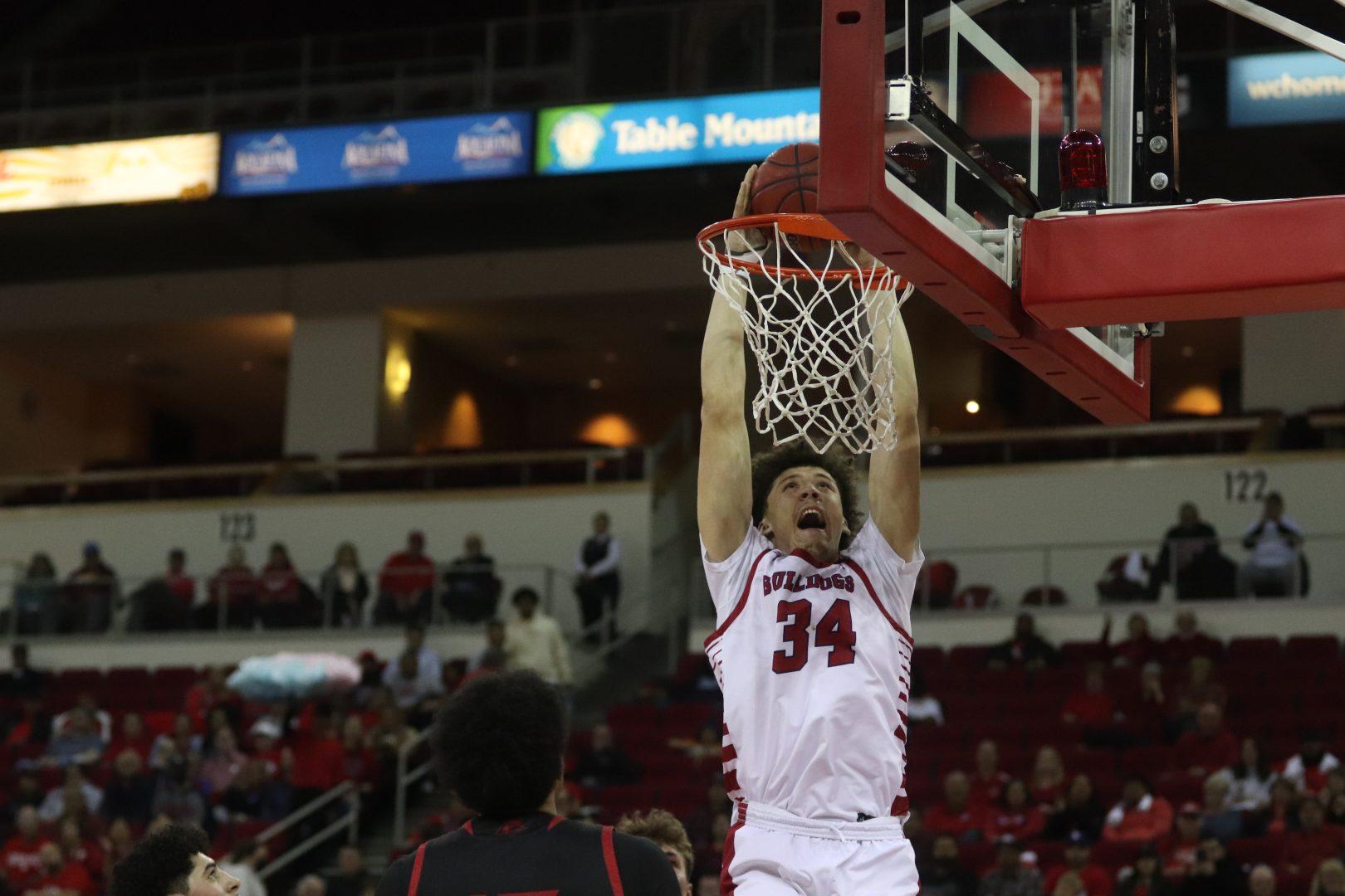 Center Braxton Meah dunks the ball in the semifinal game against Southern Utah on March 28, 2022 at Save Mart Center. (Melina Kazanjian/The Collegian)