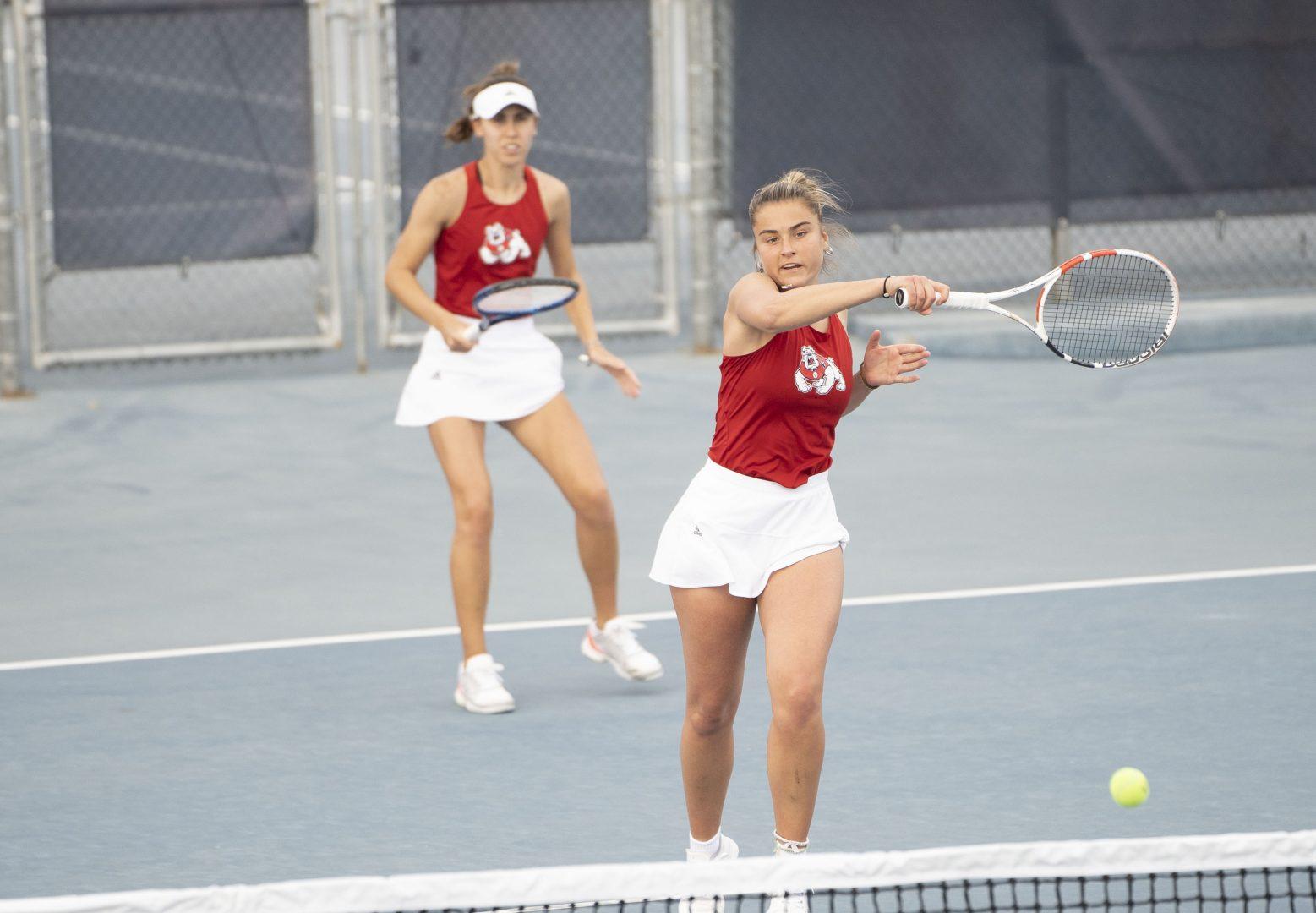 Junior Carlotta Nonnis Marzano (right) and Sophomore Carolina Piferi (left) compete in doubles against Saint Marys College on Wednesday, Feb. 2, 2022, at the Spalding G. Wathen Tennis Center. (Wyatt Bible/ The Collegian)