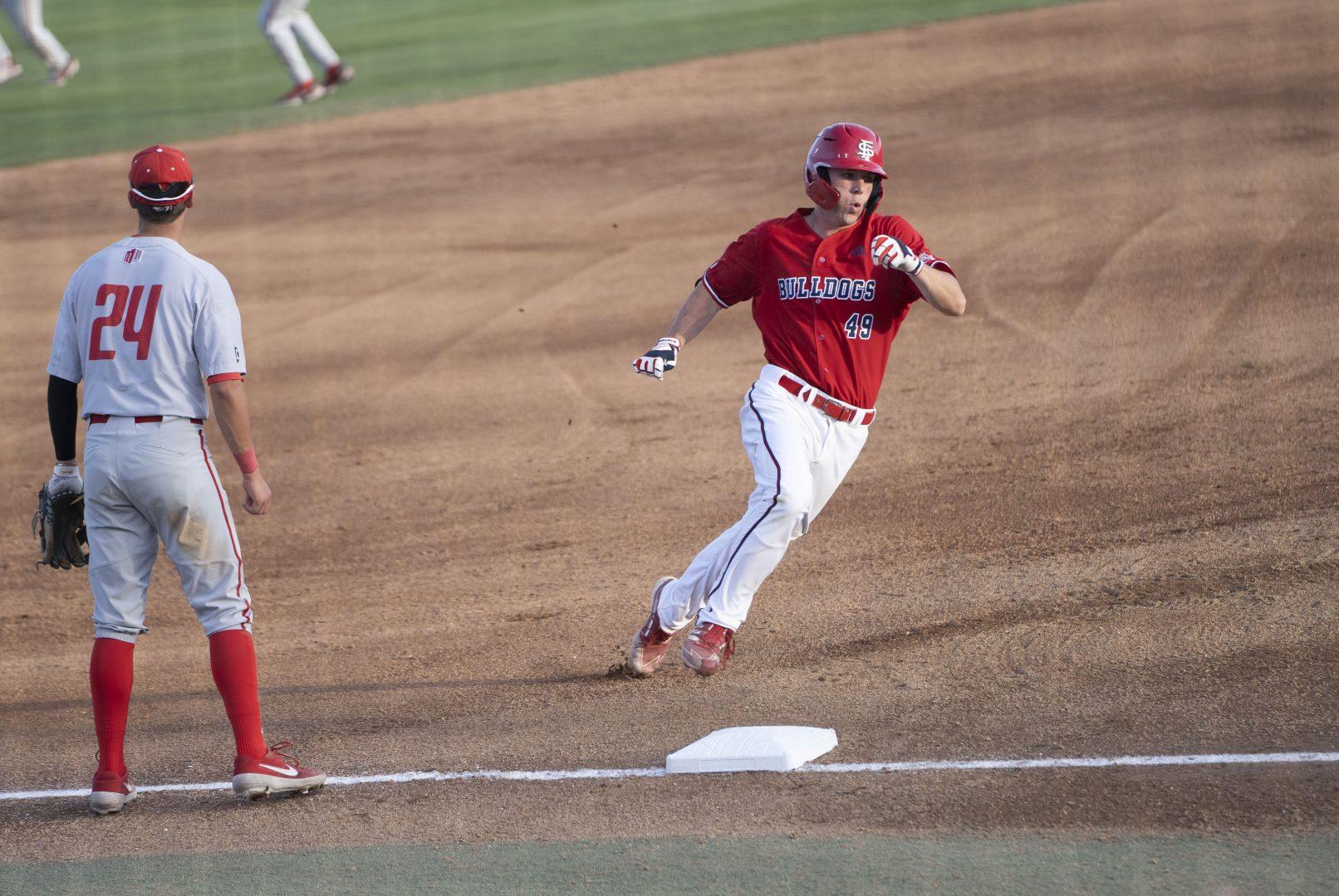 Tommy Hopfe rounds the base in the game against New Mexico on April 9, 2022 on Pete Beiden Field at Bob Bennett Stadium. (Wyatt Bible/ The Collegian)
