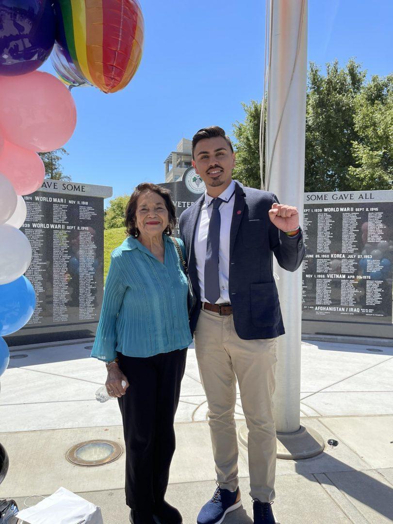 Estevan Parra Guerrero with Dolores Huerta at the inaugural pride flag raising at Fresno City Hall in June 2021. (Courtesy of Estevan Parra Guerrero)