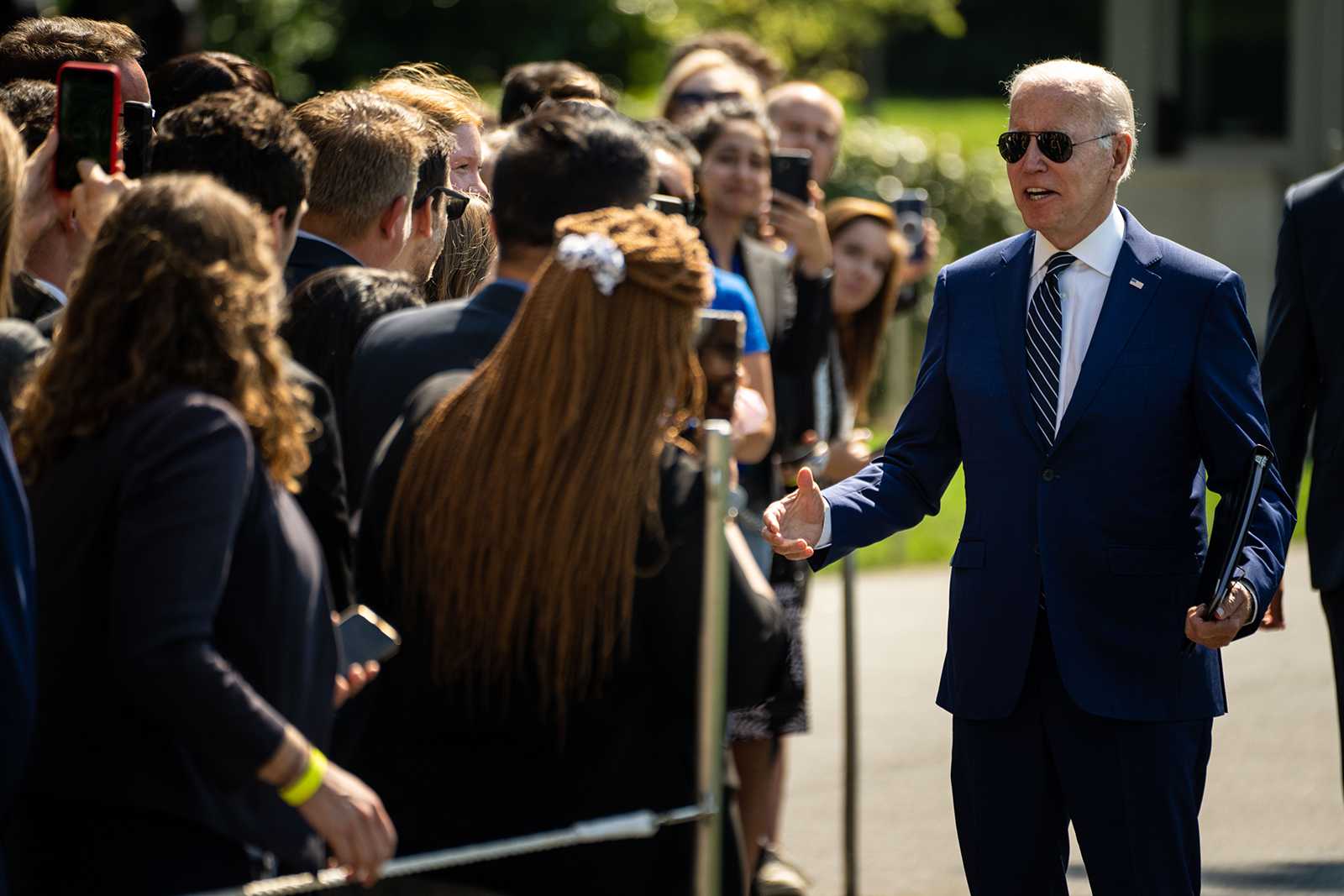 President Joe Biden greets guests after disembarking from Marine One, returning to the White House from Rehoboth, Delaware, on the South Lawn of the White House on Wednesday, Aug. 24, 2022, in Washington, DC. (Kent Nishimura/Los Angeles Times/TNS)
