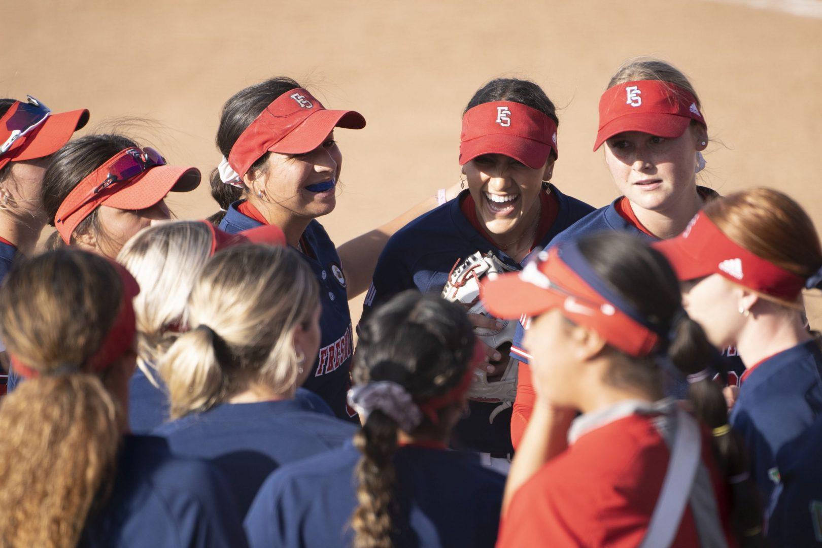 The Fresno State Softball team celebrates its win over Saint Marys after the first game of the doubleheader on April 5, 2022 at Margie Wright Diamond. (Wyatt Bible/ The Collegian)