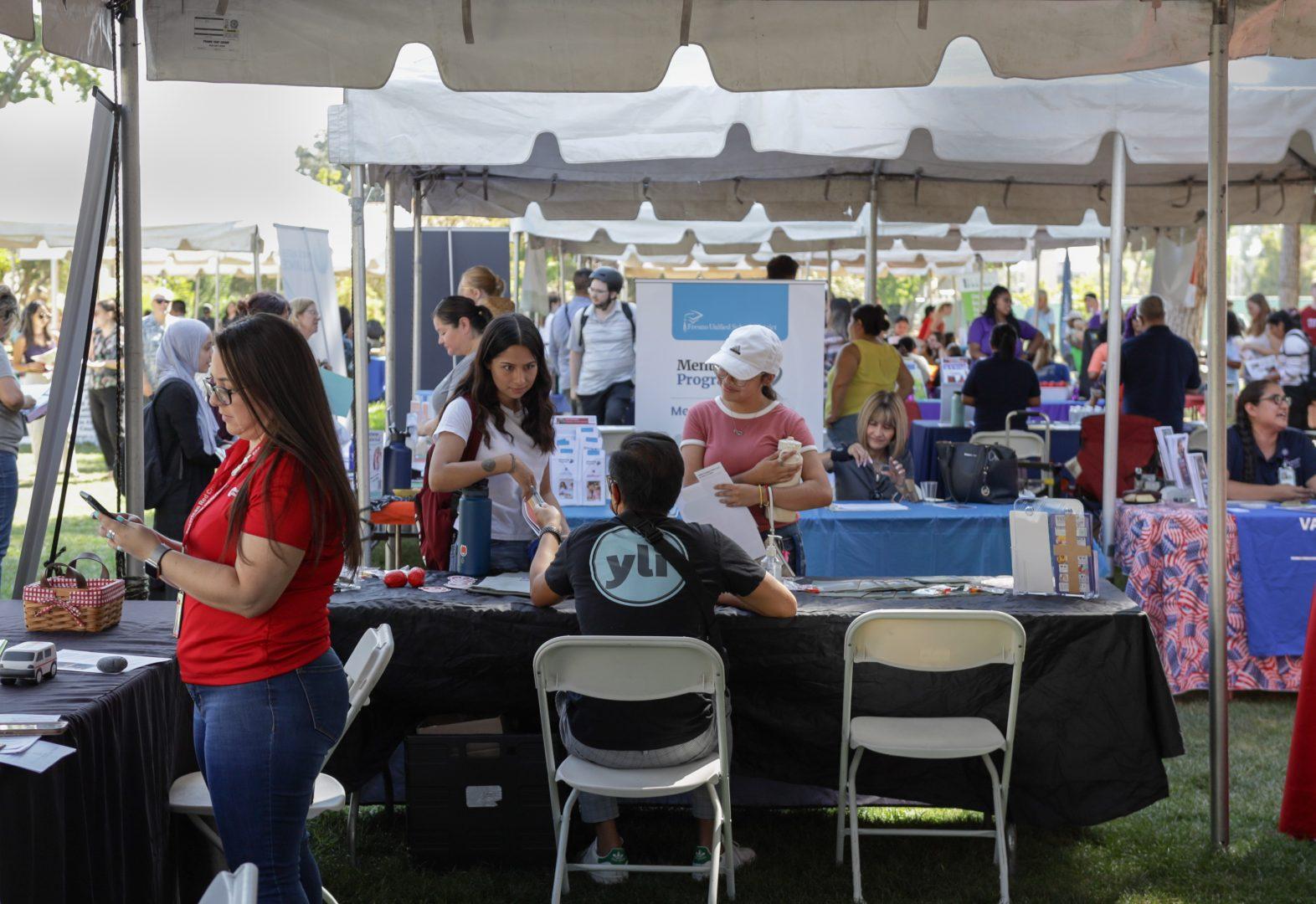 A broad view of the different booths at the Fall Community Service Opportunities Fair on Wednesday, Aug. 31, 2022 in front of Kennel Bookstore. (Carlos Rene Castro/The Collegian)