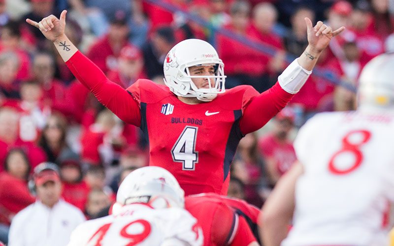 Fresno State quarterback Derek Carr (4) directs the offense during the Bulldogs’ 69-28 win over New Mexico Saturday at Bulldog Stadium. The Bulldogs will represent the West Division in the Mountain West’s inaugural championship game on Dec. 7, 2013. Roe Borunda / The Collegian