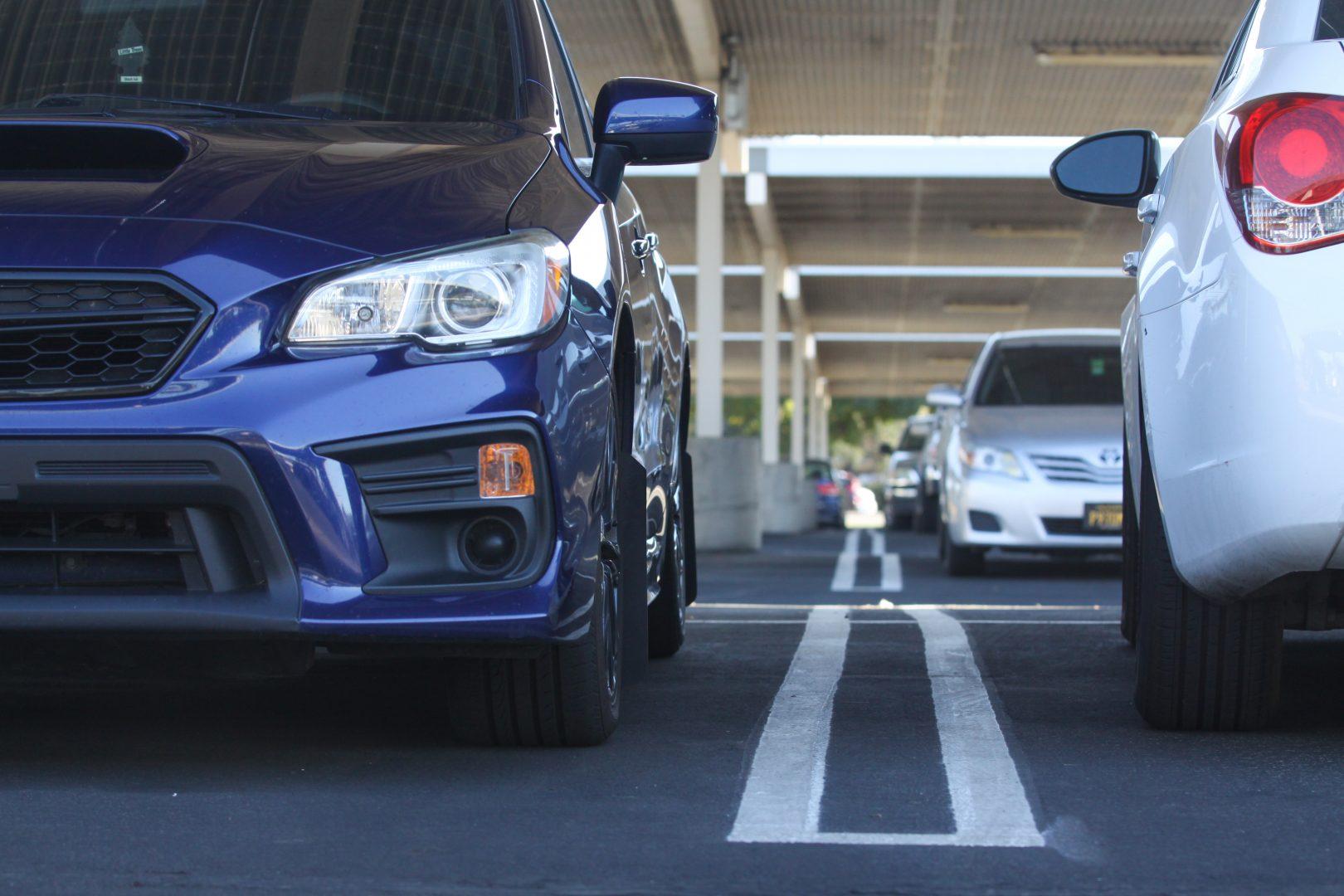 Cars parked under the panels in the P2 lot on Sept. 22. (Carlos Rene Castro/The Collegian)